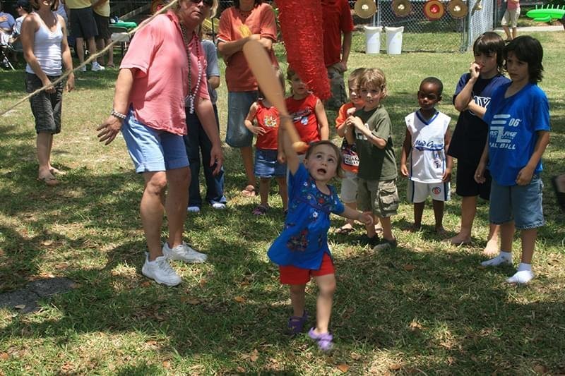 Cypress Meadows Church kids-outside-hitting-a-pinata.jpg
