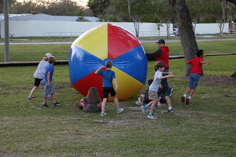 Cypress Meadows Church Kids Playing With Large Inflatable Ball Clearwater FL.jpg