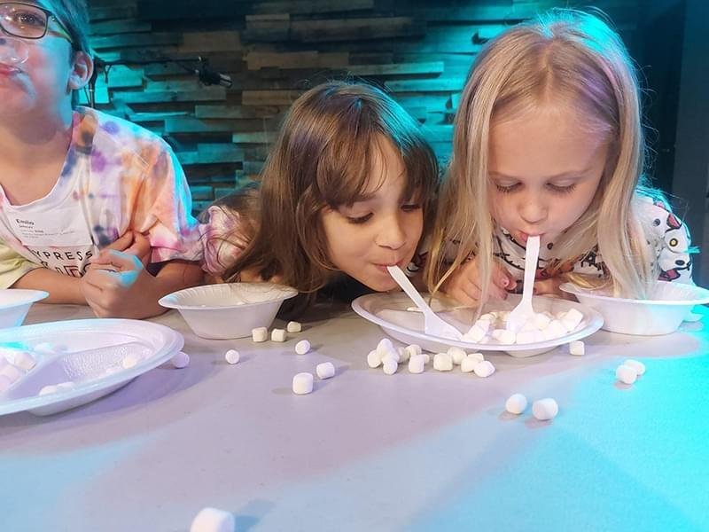 Cypress Meadows Church kids-spoons-in-mouth-scooping-marshmallows.jpg
