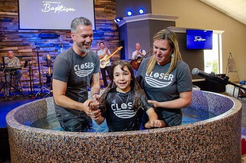 Cypress Meadows Church pastor-eric-and-leah-baptizing-child-01.jpg