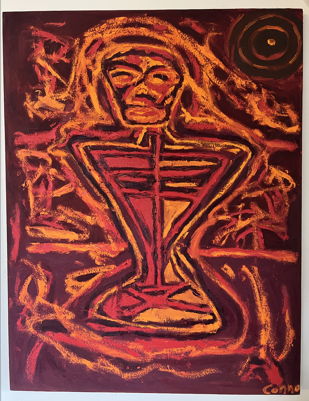 Abstract painting of a figure with glasses and a striped shirt, sitting cross-legged with hands on hips, surrounded by swirling red, orange, yellow, and black lines.