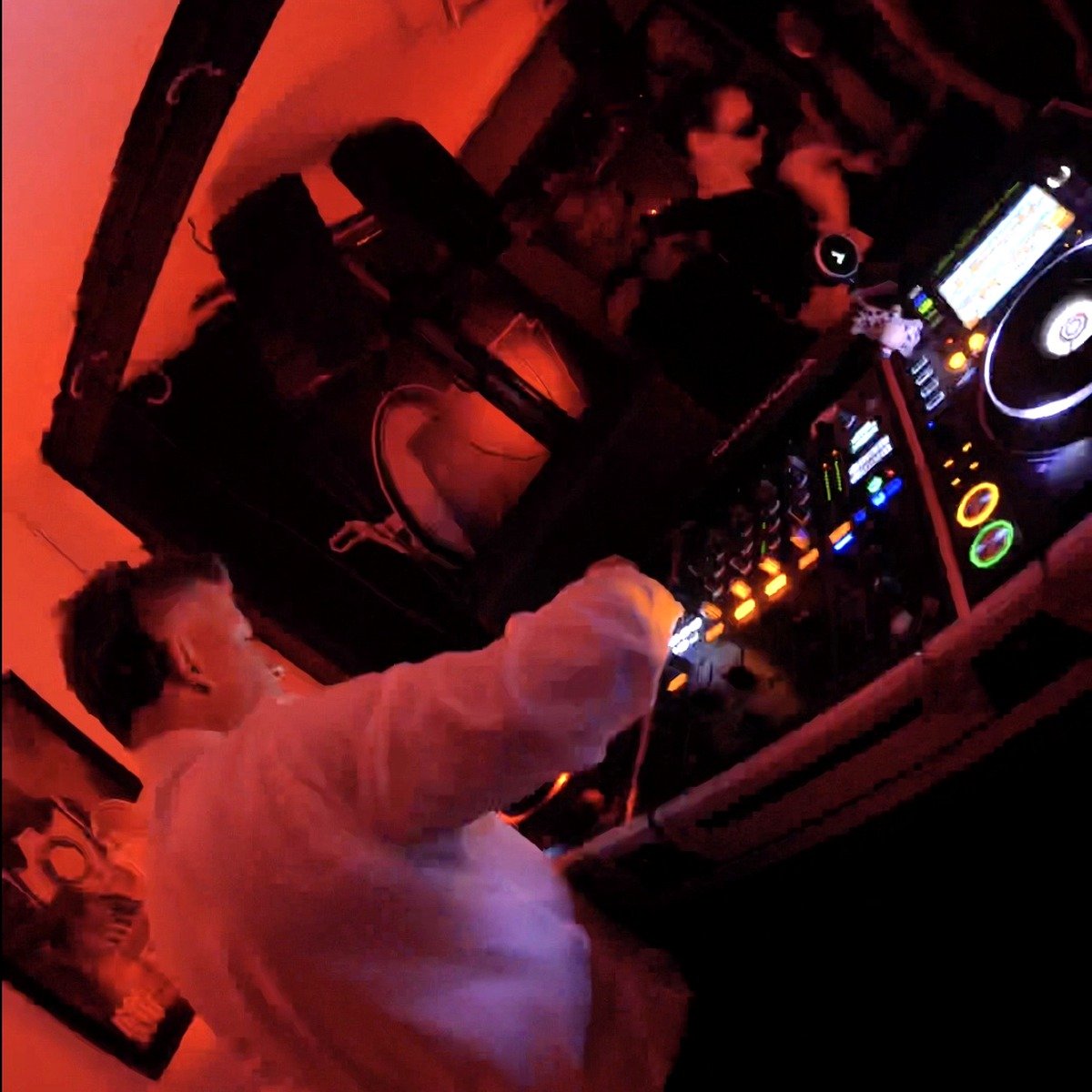 PRTTYUGLY performing a techno DJ set in a club booth