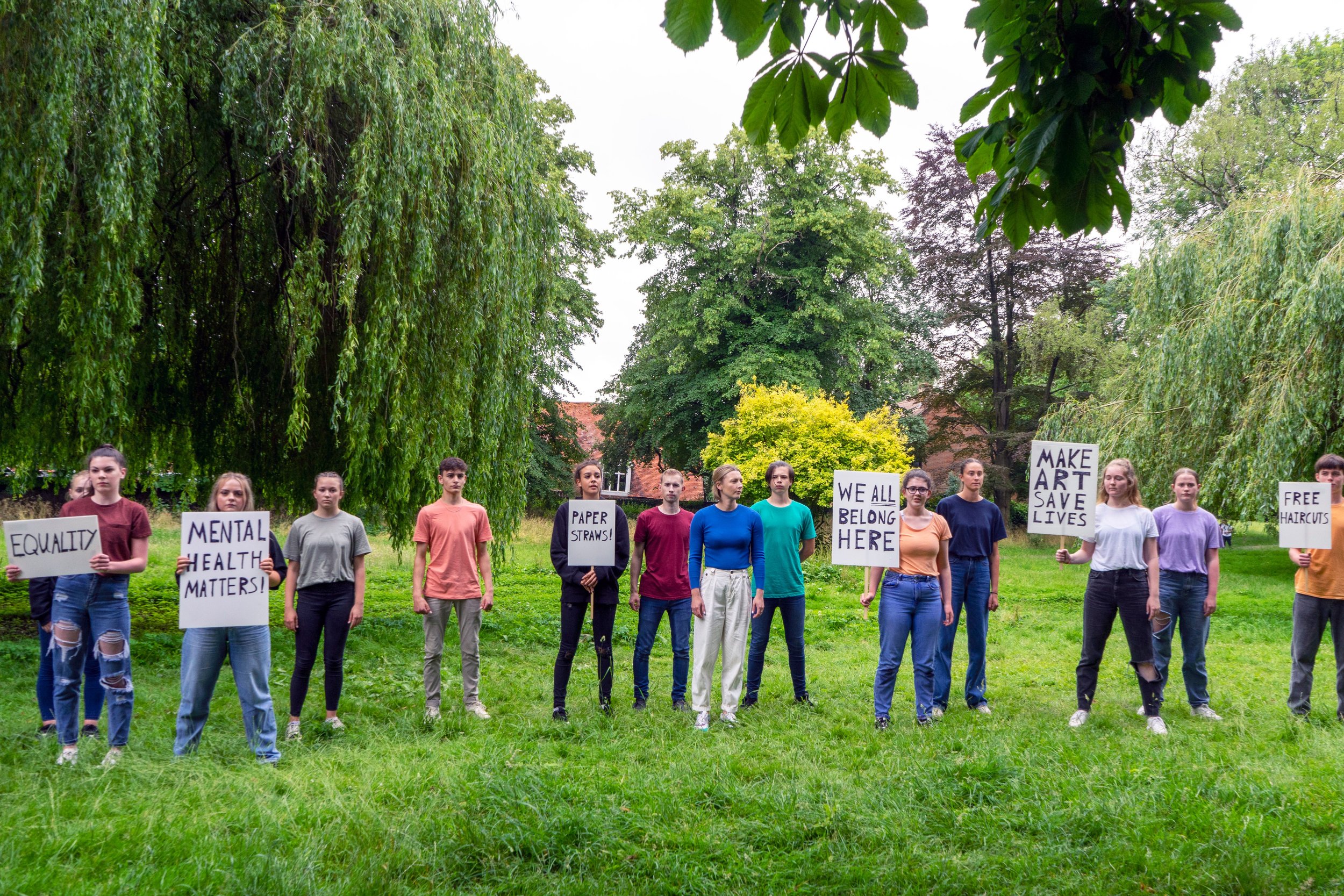 support us group with placards.jpeg