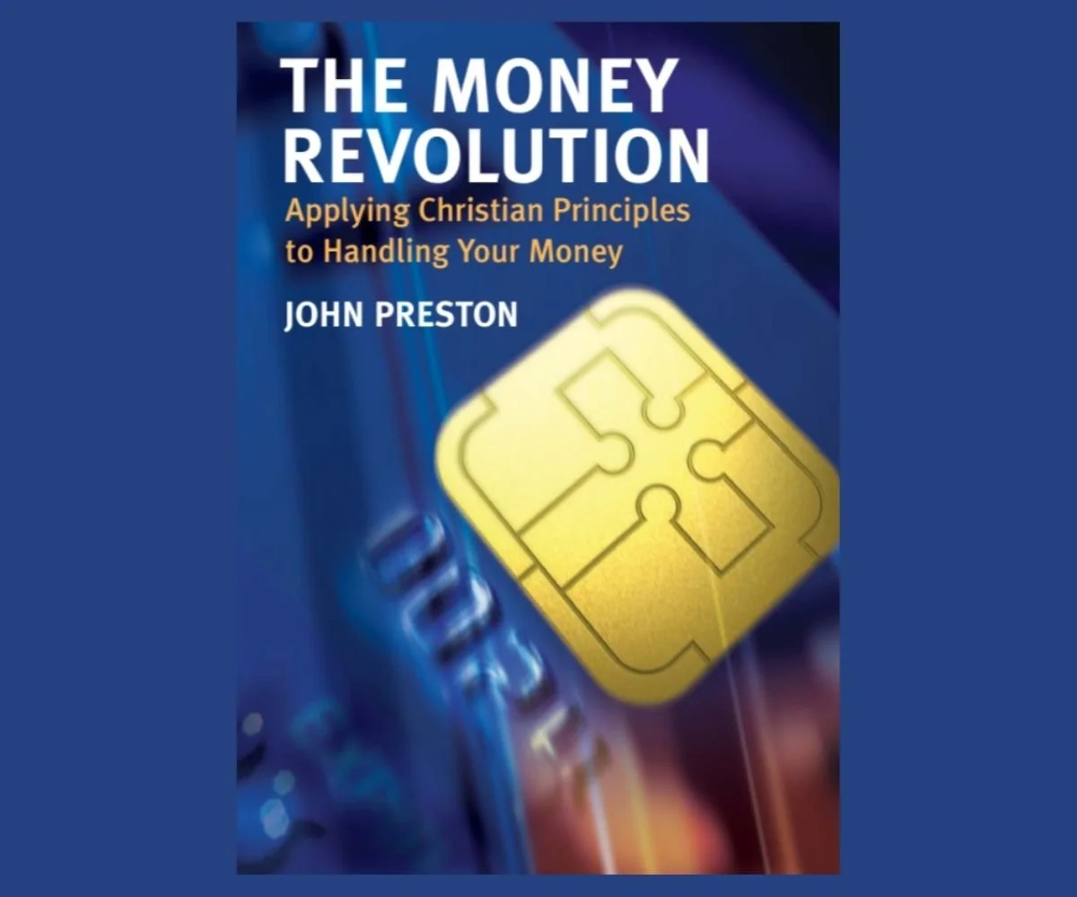Cover of The Money Revolution, a rich blue with a yellow  imitation credit card chip with shape of the Cross and the book title in white block text. 