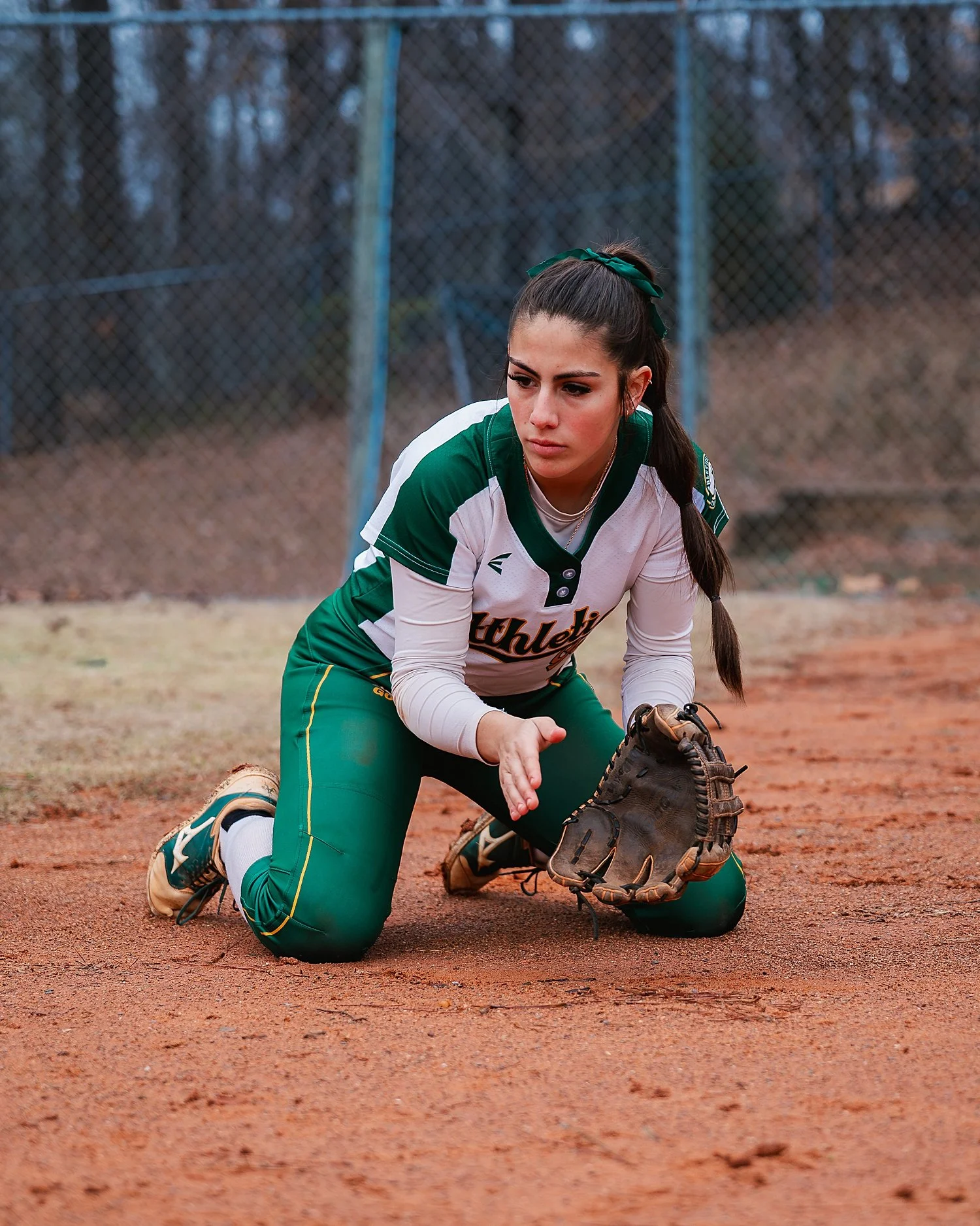  athlete kneeling in the dirt to catch a ball by Atlanta sports photographer  