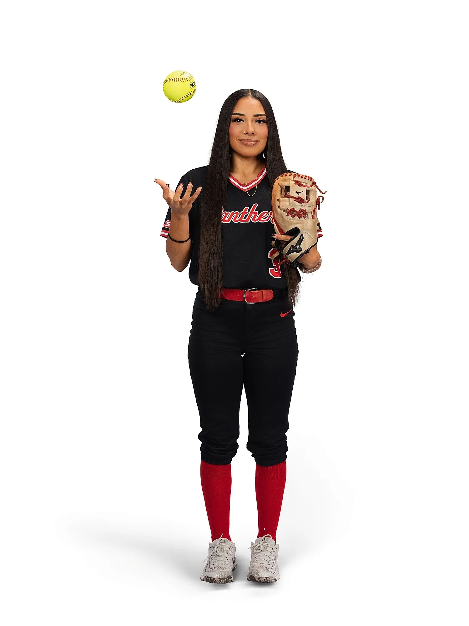  player bounces ball in the air for her travel softball teams 