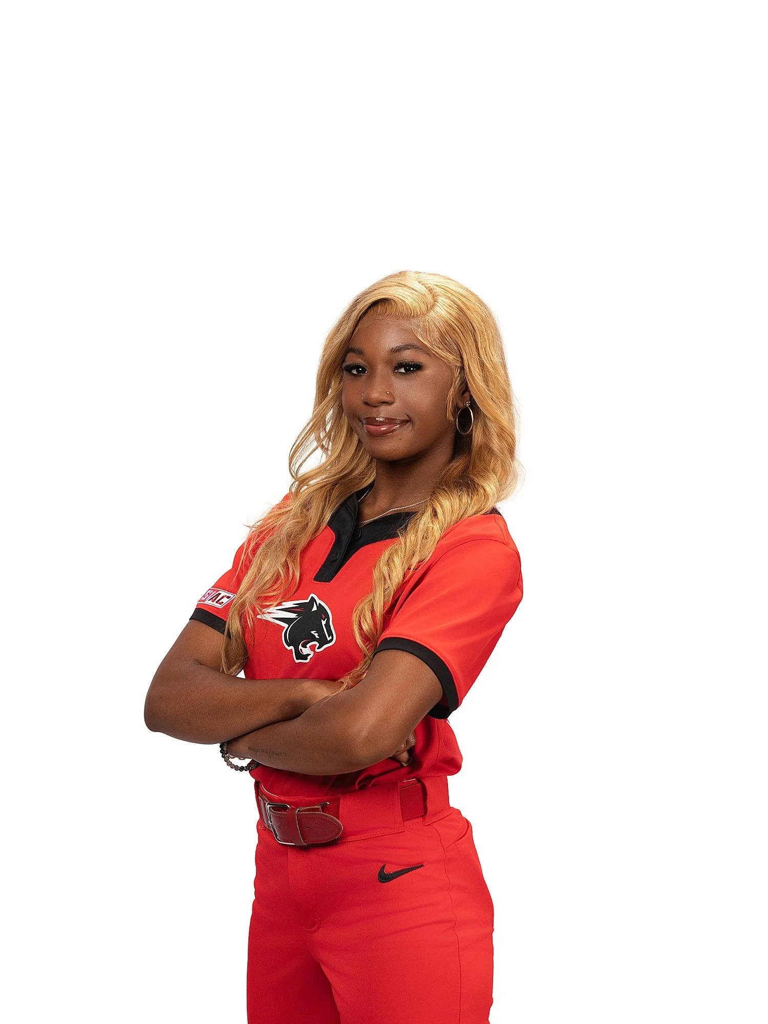  woman in red jersey stands with arms folded by Atlanta sports photographer 