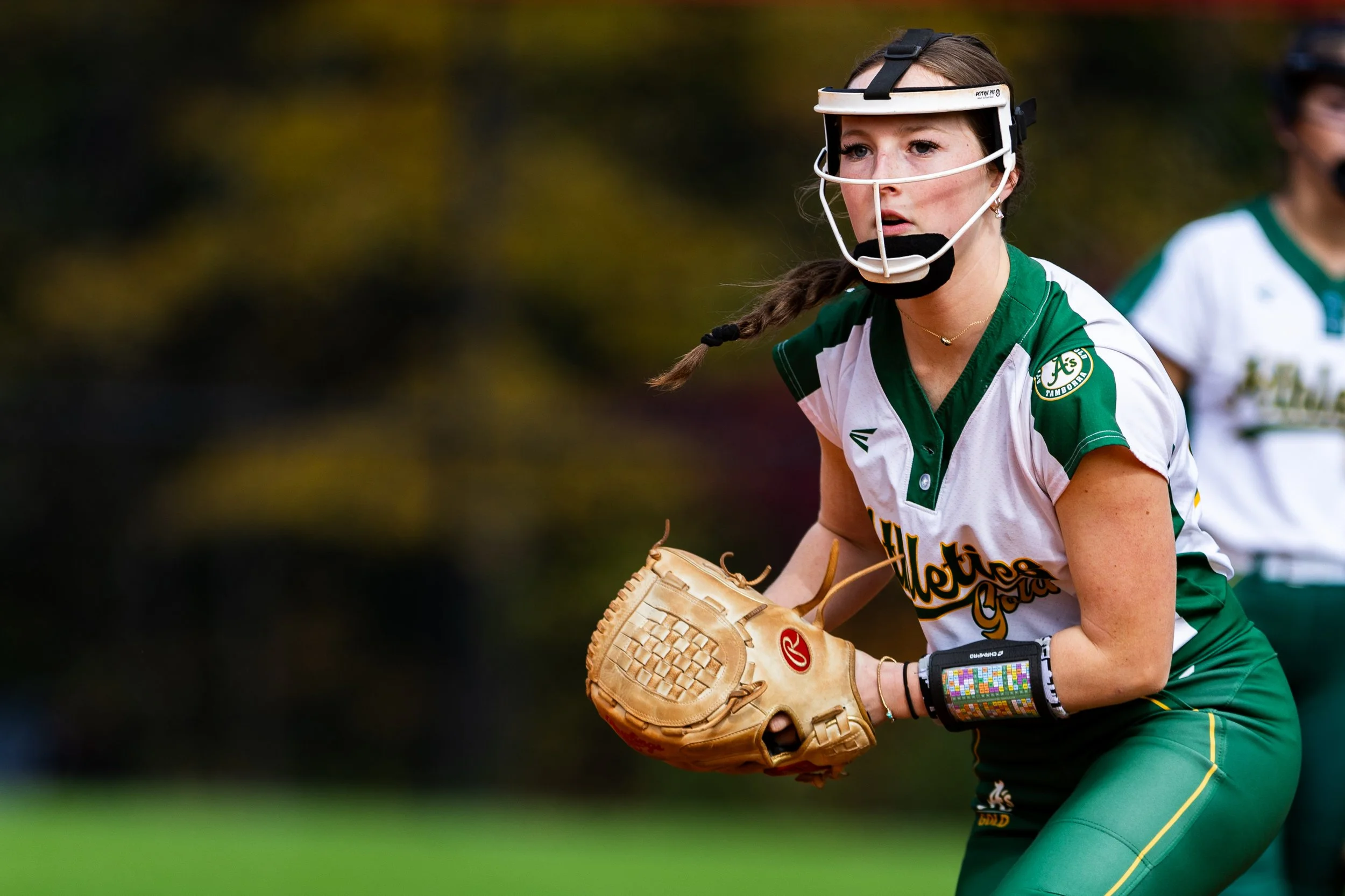  woman playing softball by Tiaras Monet Photography 