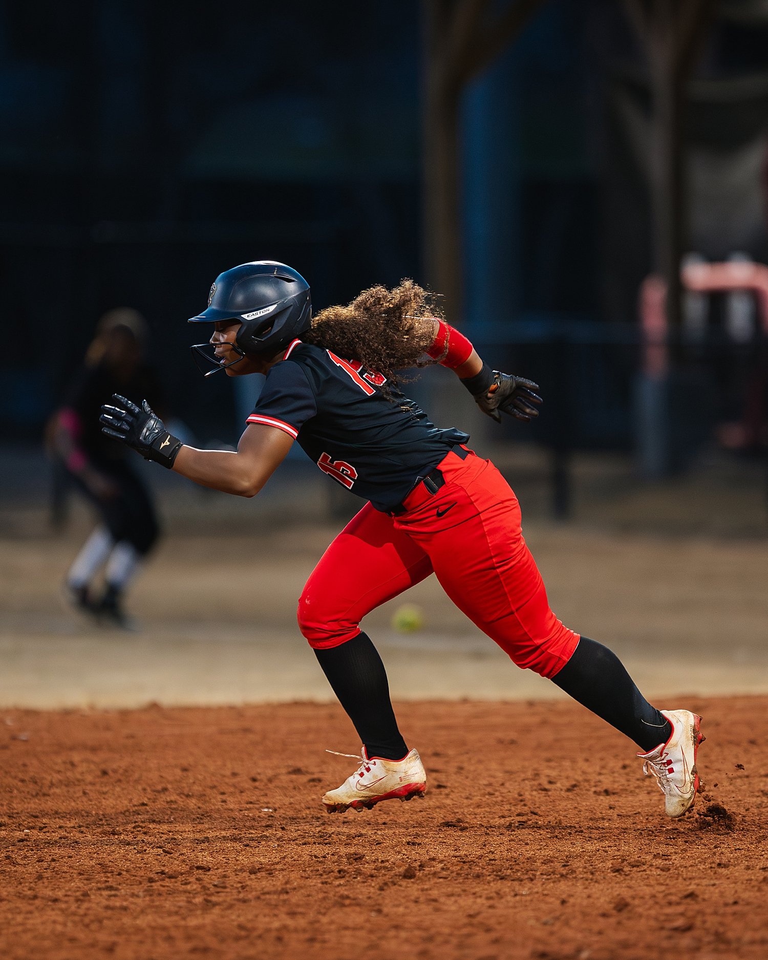  athlete running bases in black &amp; red uniform by Atlanta sports photographer 