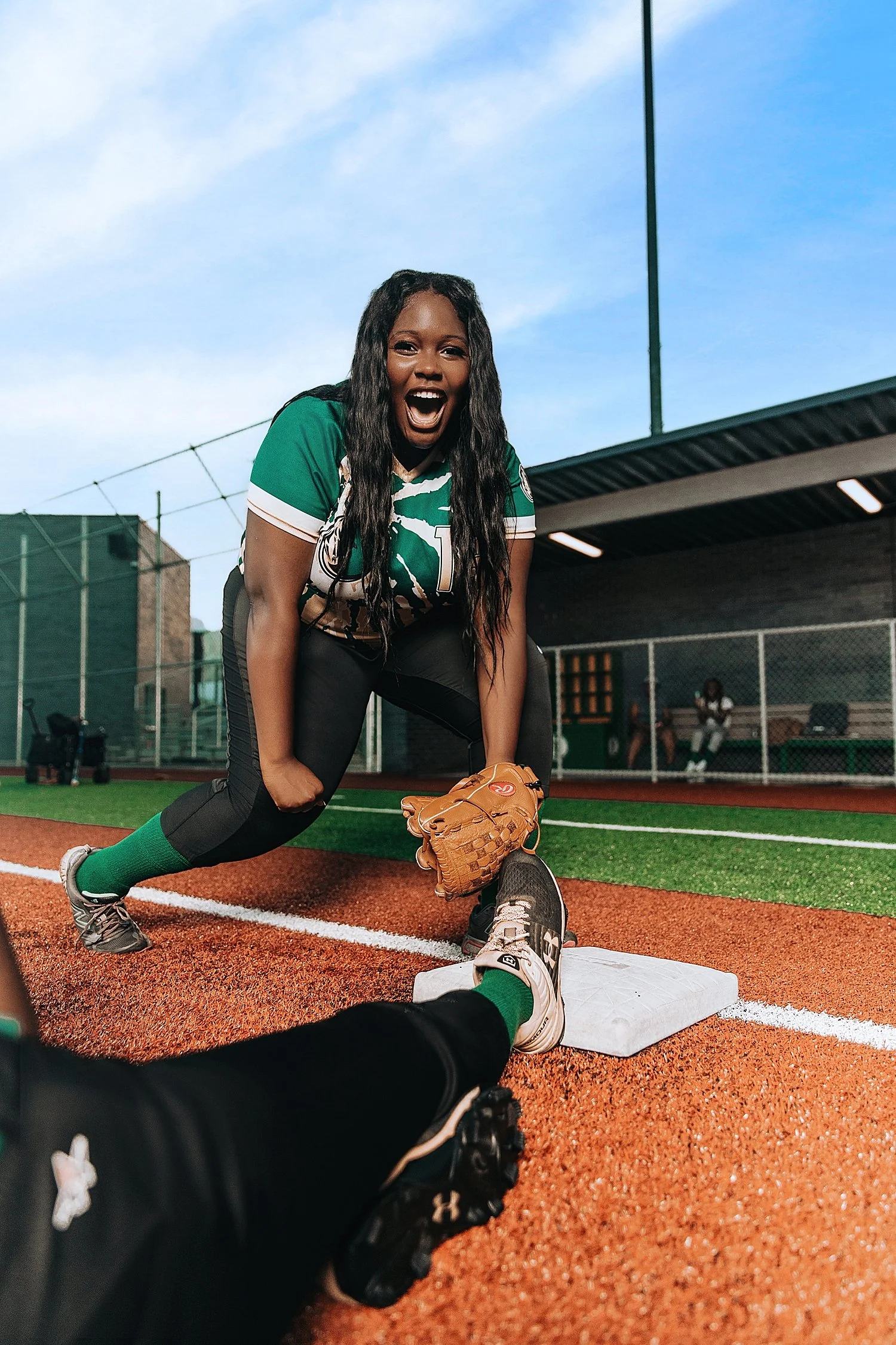 athlete kneeling on the ground to catch a ball by Tiaras Monet Photography 