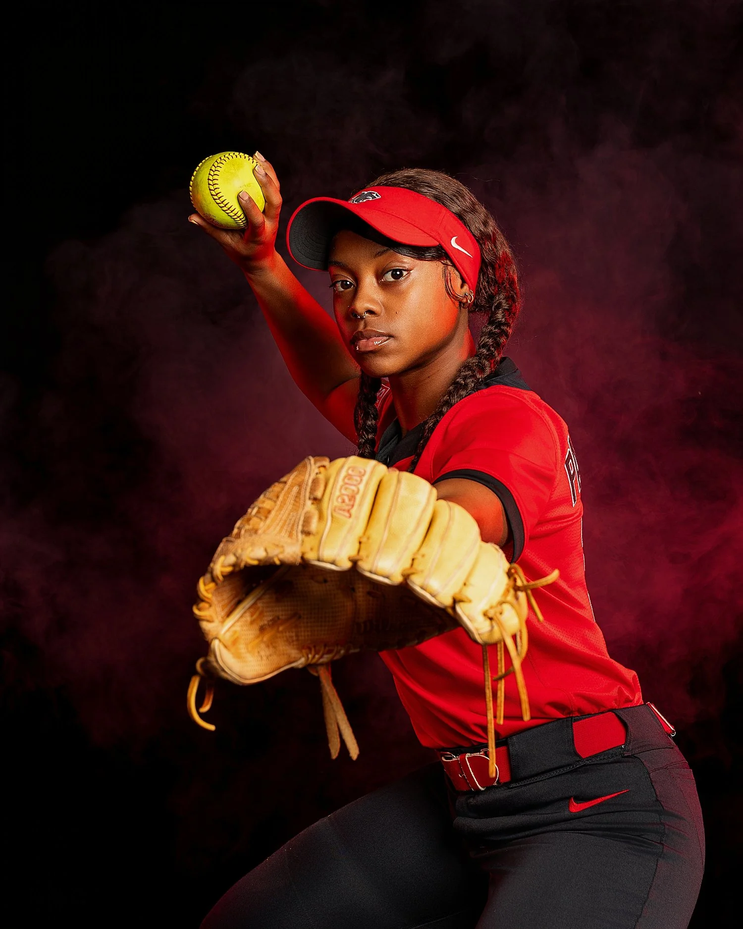  Athlete holds up ball to throw in studio session by Tiaras Monet Photography 