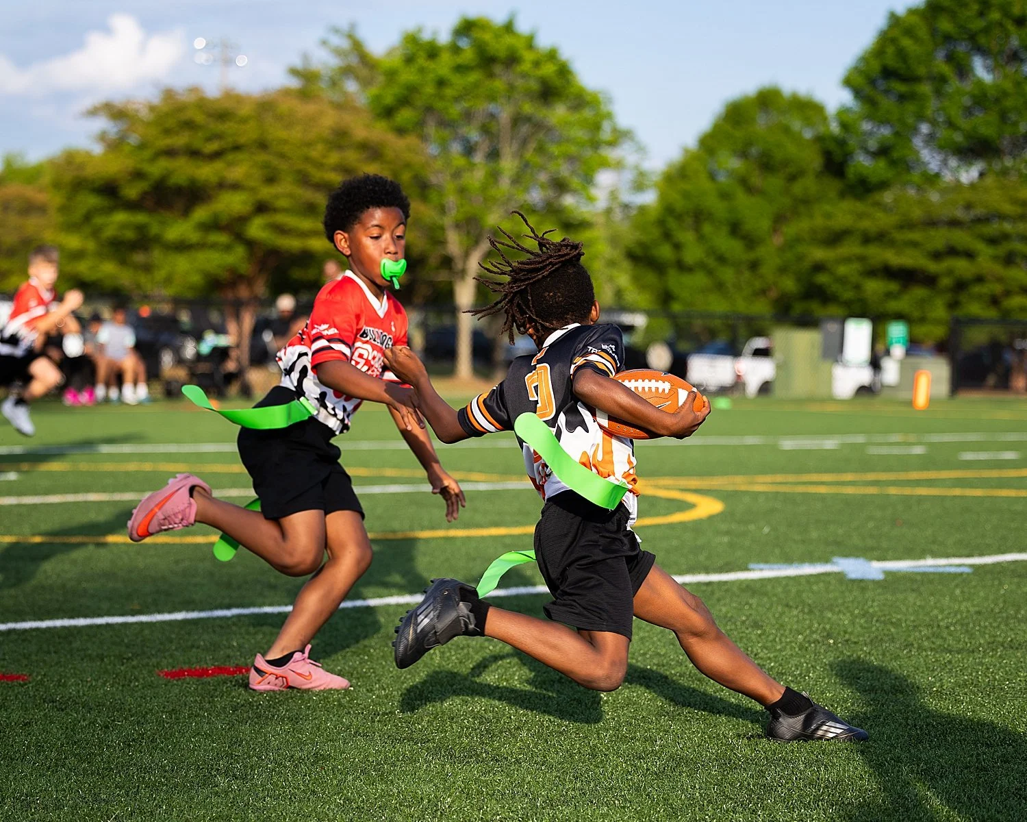 two boys playing flag football myth busting sports photography hesitations