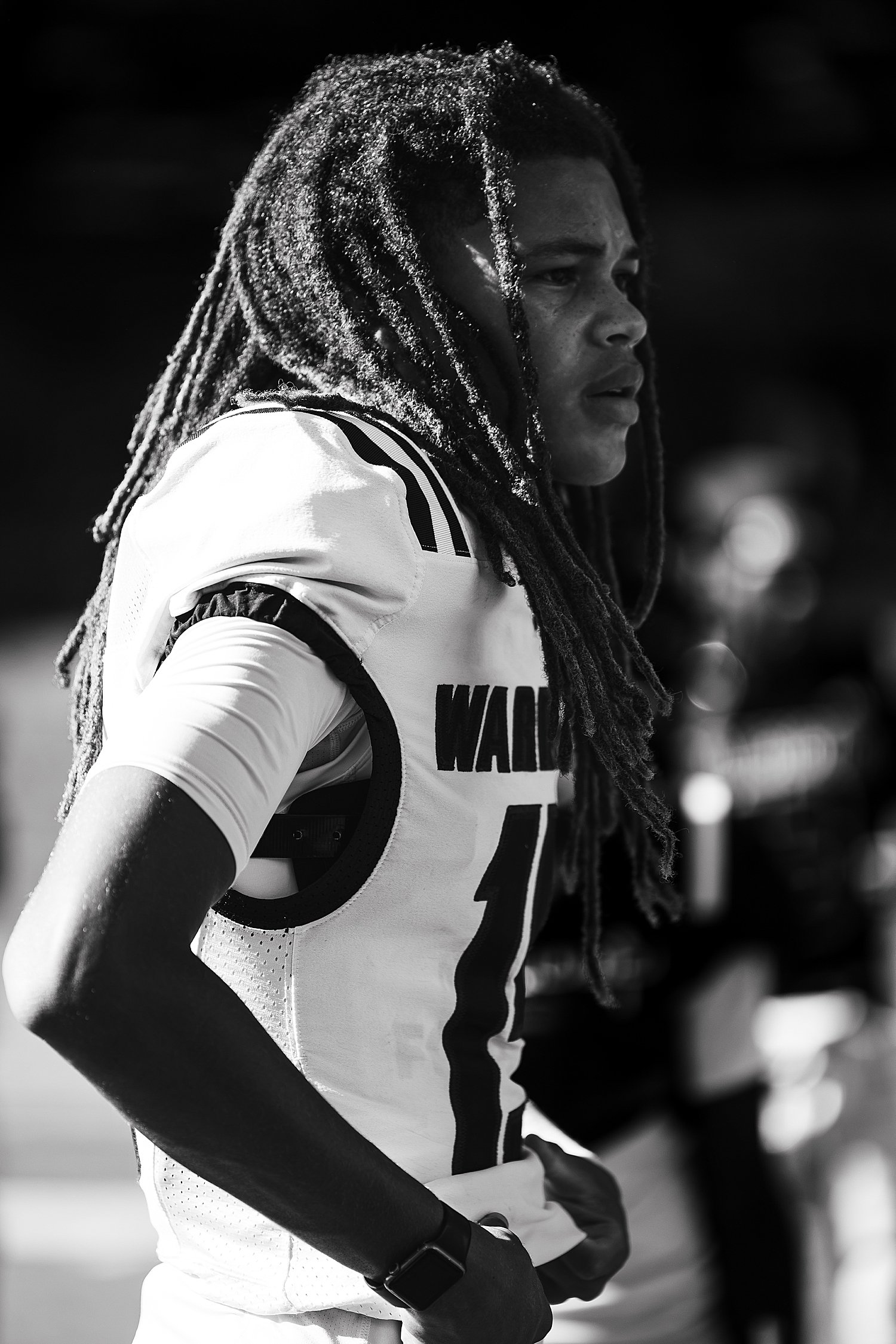 football player looks out at the field by Atlanta photographer