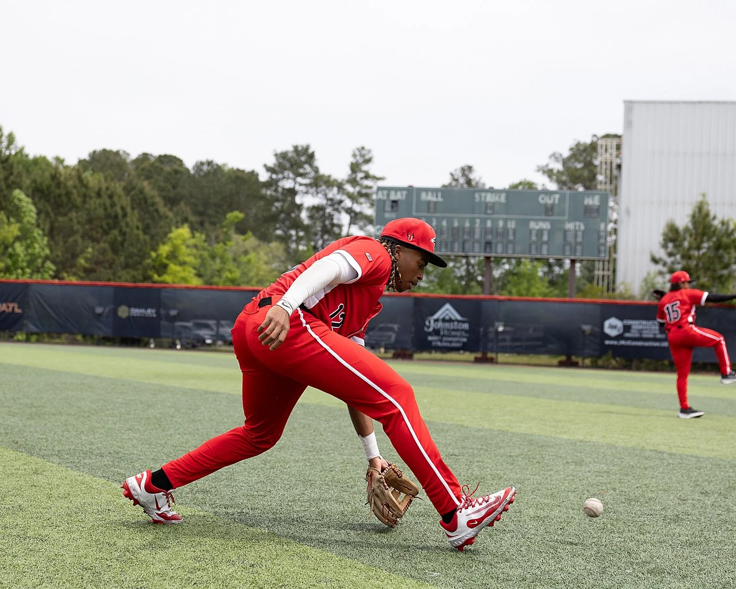 person catches baseball on field by Atlanta sports photographer