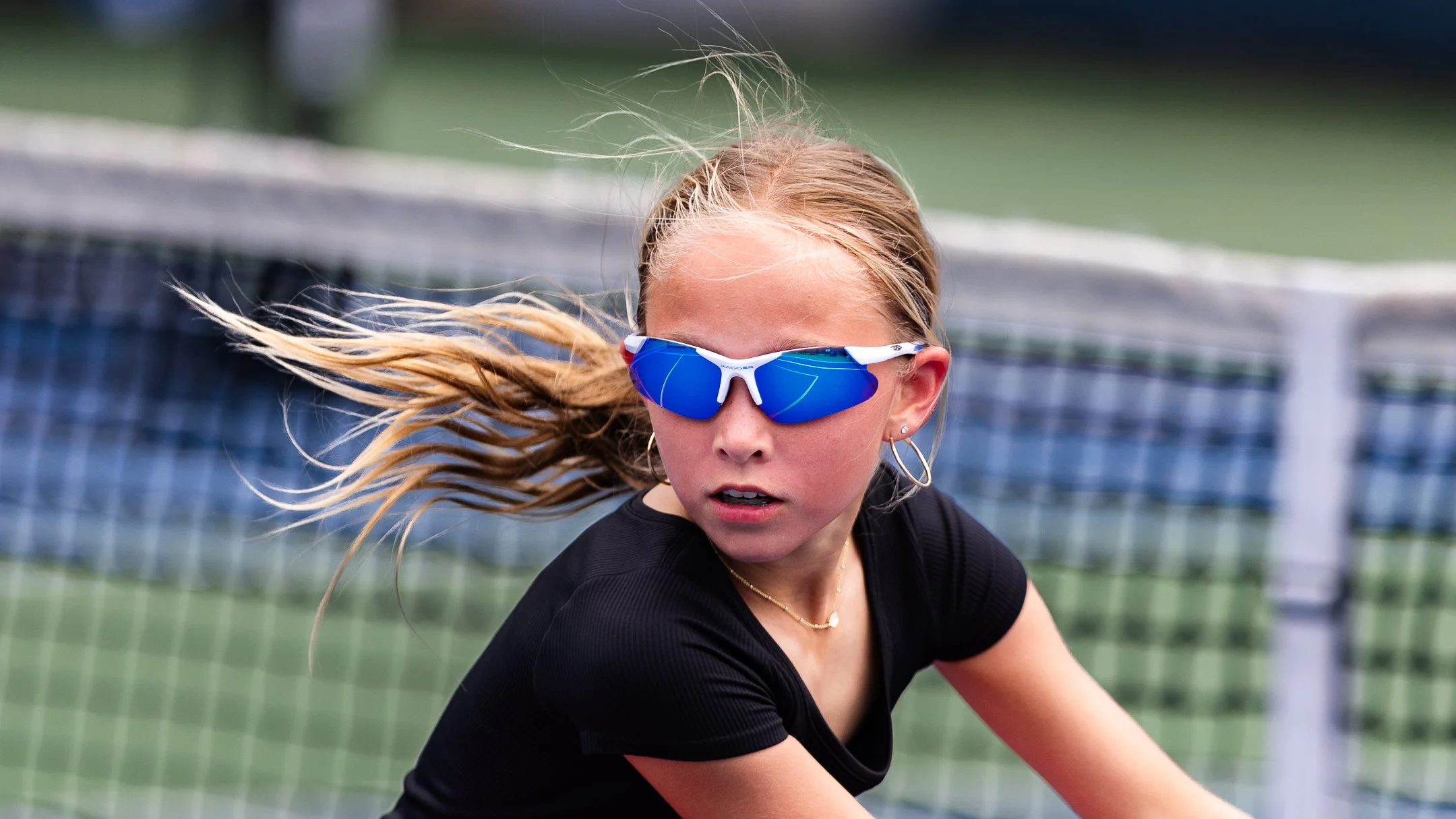 girl plays tennis on sunny day by Atlanta sports photographer