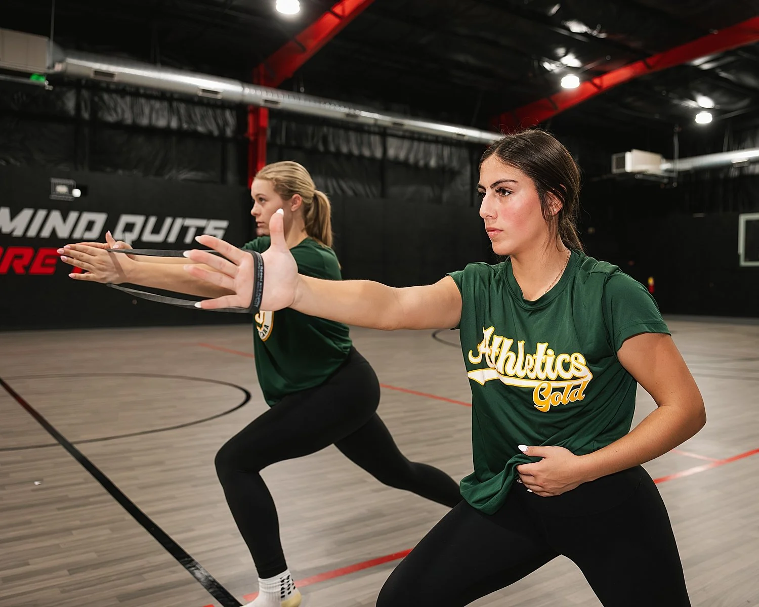 women training with resistance bands in gym showing 5 photos every athlete needs