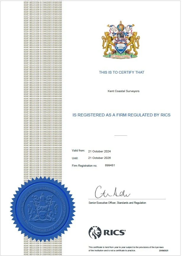 Certificate indicating registration of Kent Coastal Surveyors as a regulated firm by RICS, valid from October 21, 2024, to October 21, 2026, with a blue official seal and signature.