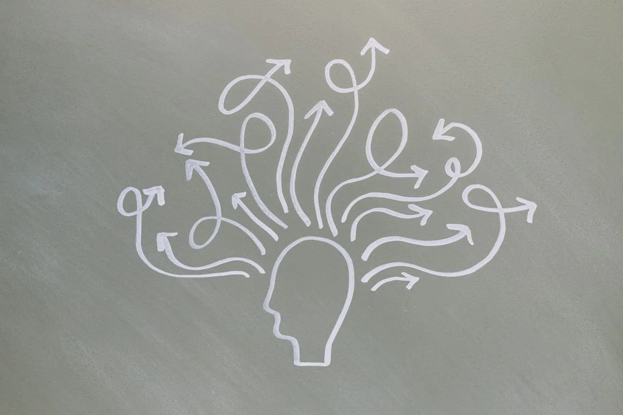 conceptual drawing illustrating mental health challenges with arrows representing thoughts