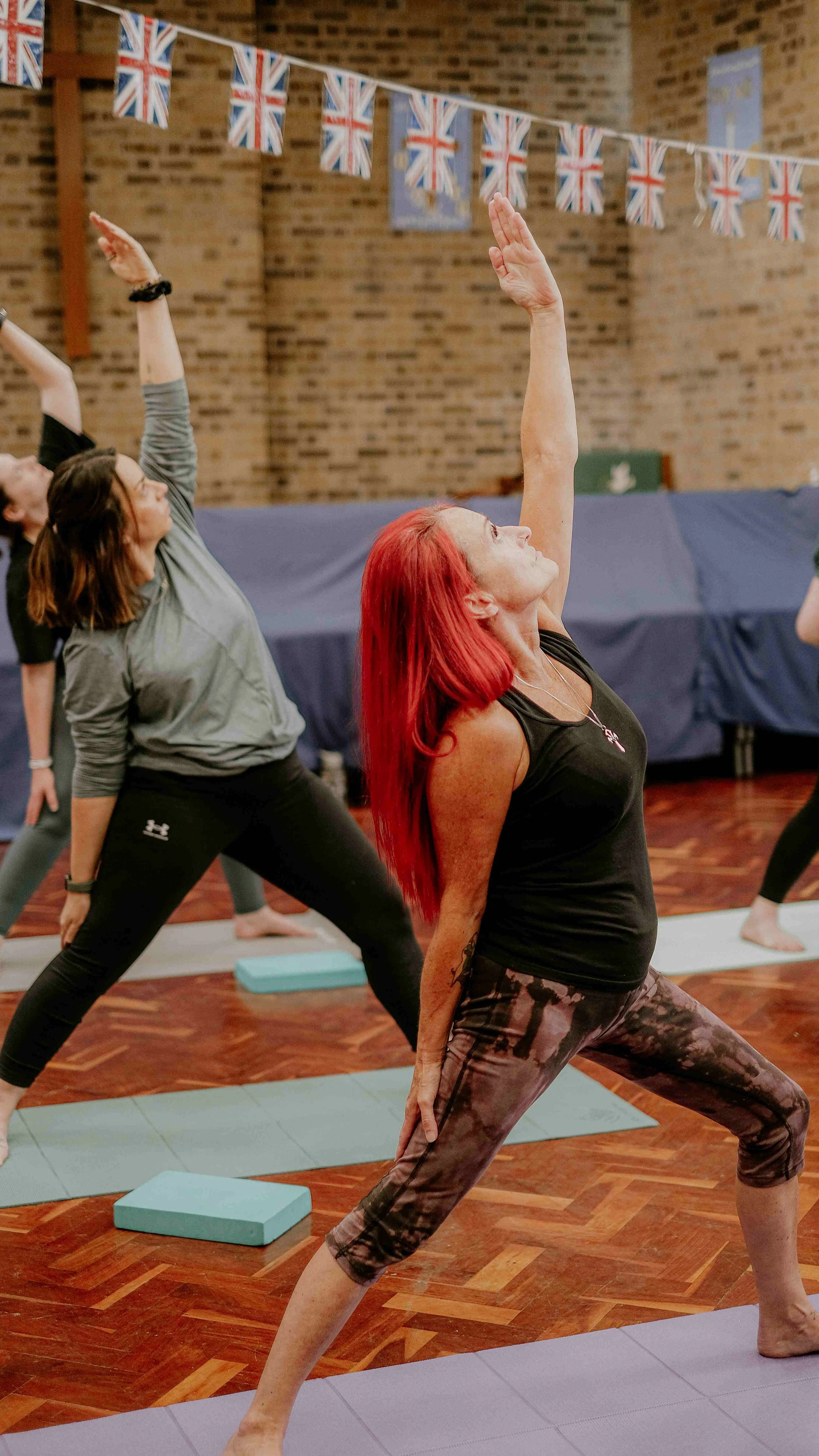 Image shows yoga student in Downward facing Dog - a popular yoga pose