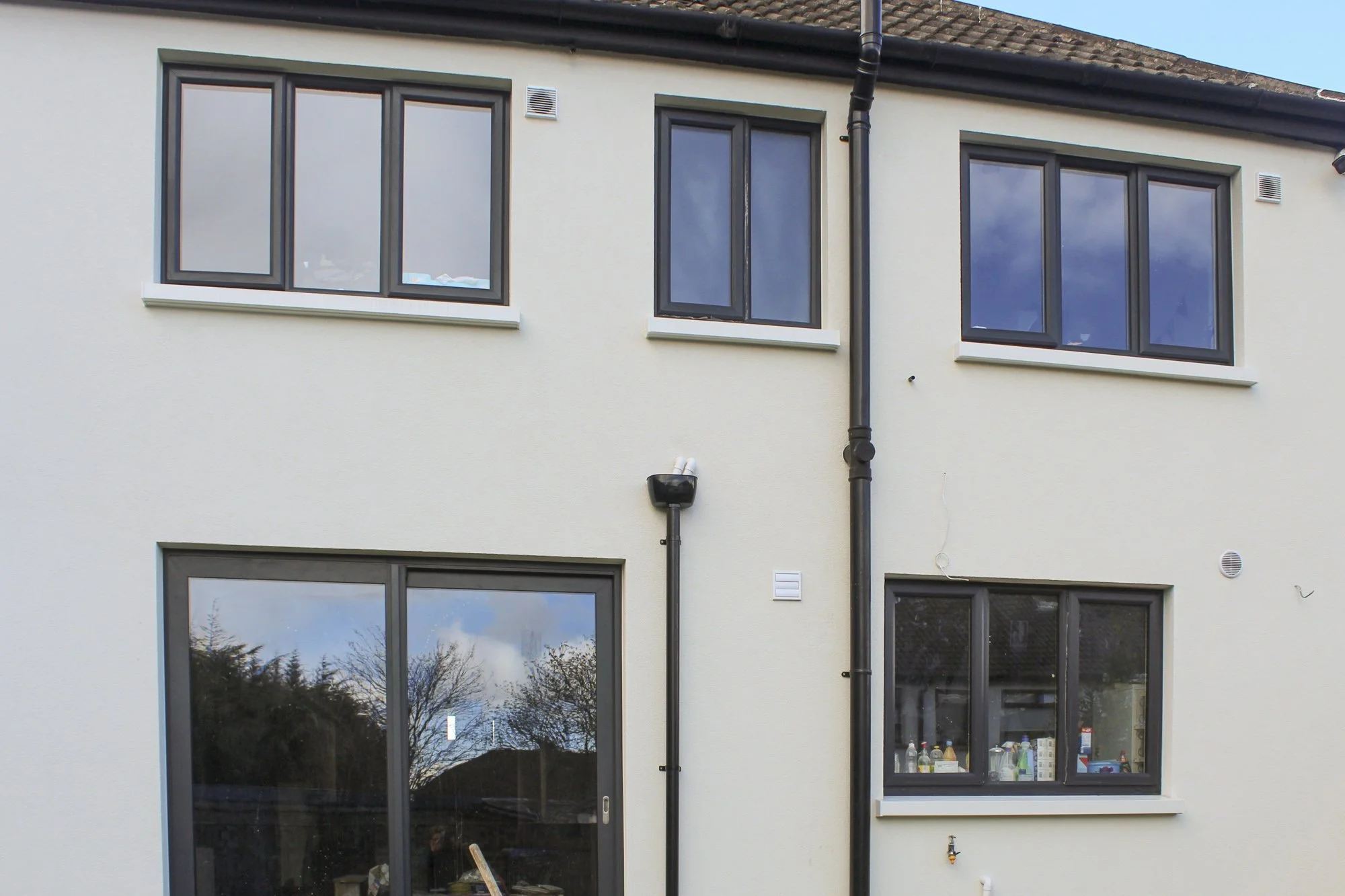 Rear windows after home energy upgrade.