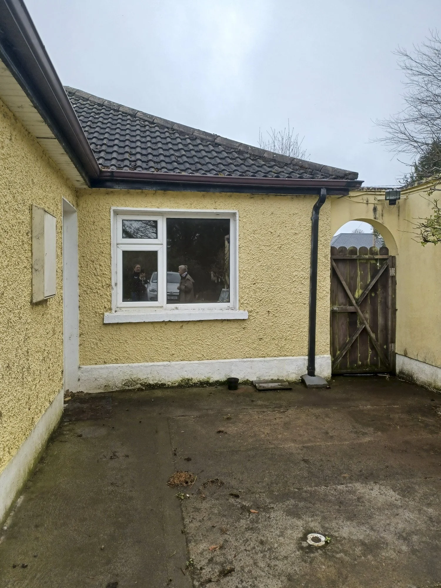 Courtyard before home energy upgrade.