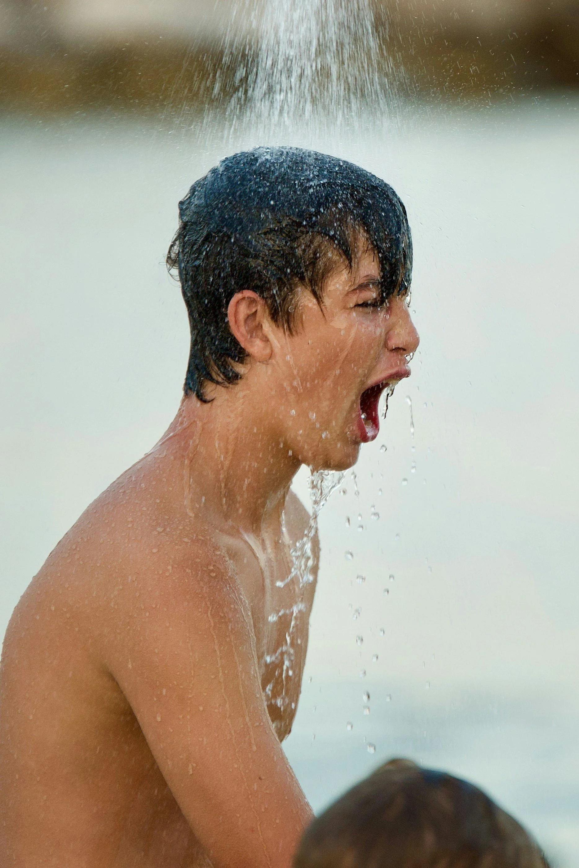 Person under cold running water illustrating the facial cold response and vagus nerve reflexes.