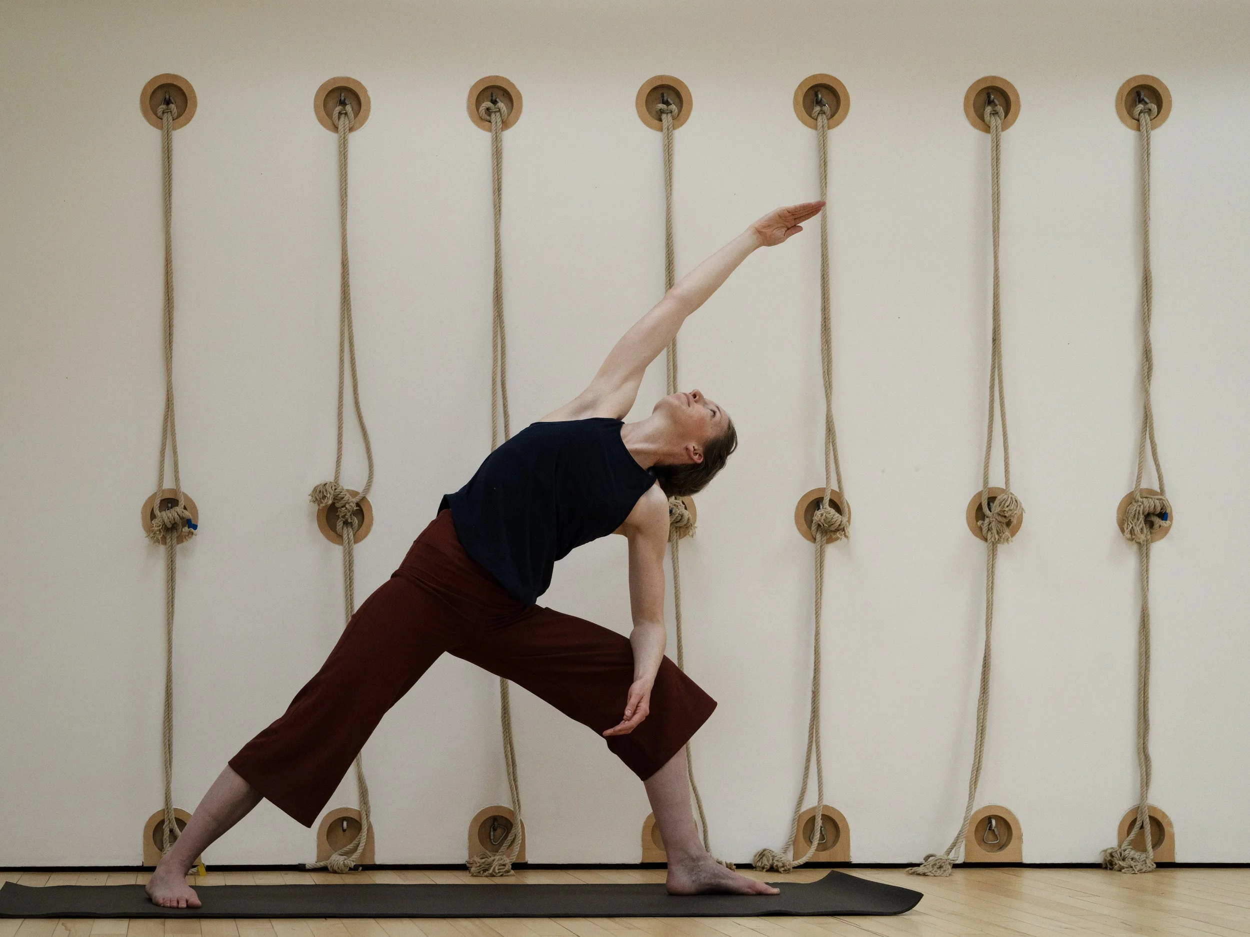Student reaching out in yoga posture