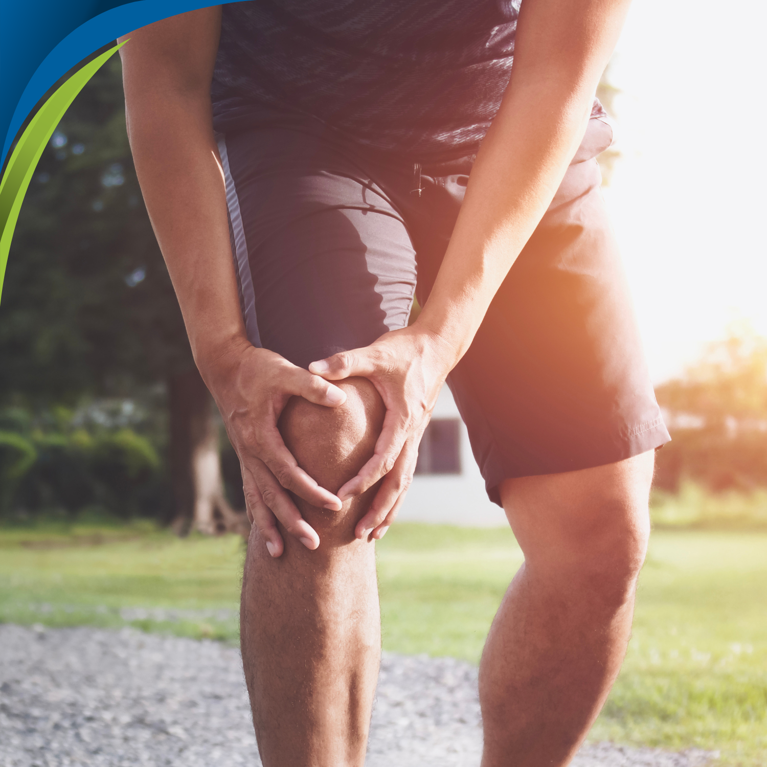 a male clutching his knee in pain