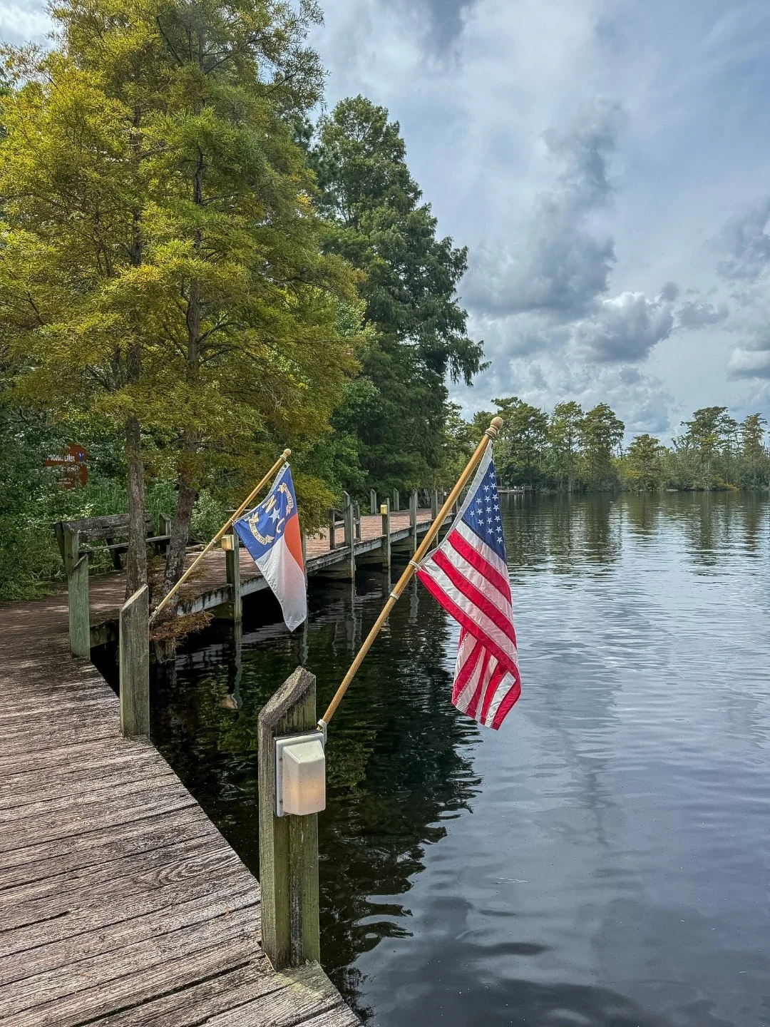American Flag & North Carolina Flag with Scuppernong River in the background