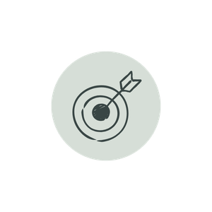 A dart hitting the bullseye in the center of a target inside a sage colored circle.