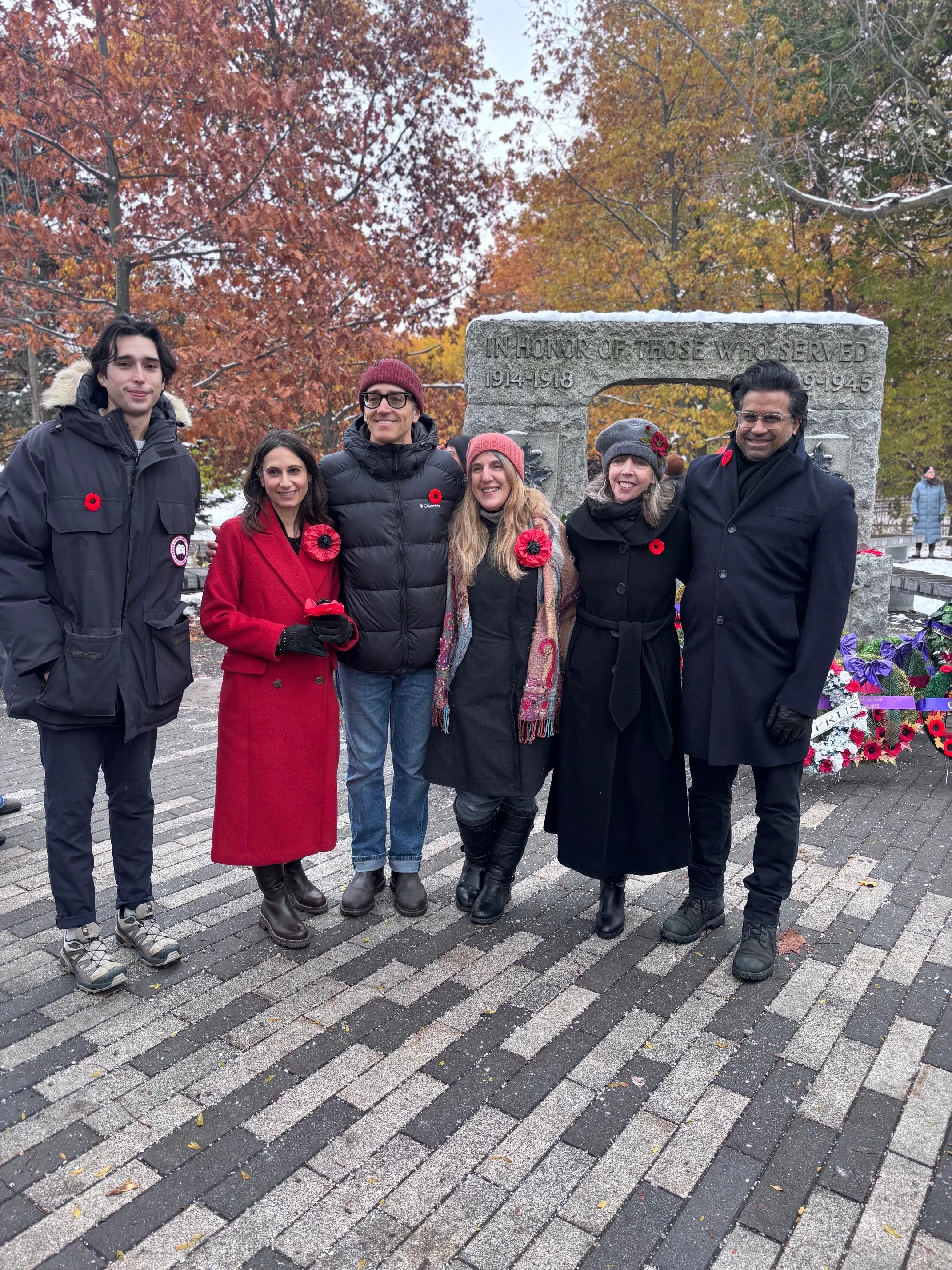 Wearing local resident's hand-made poppies at the 2025 Remembrance Day ceremony at Kew Gardens