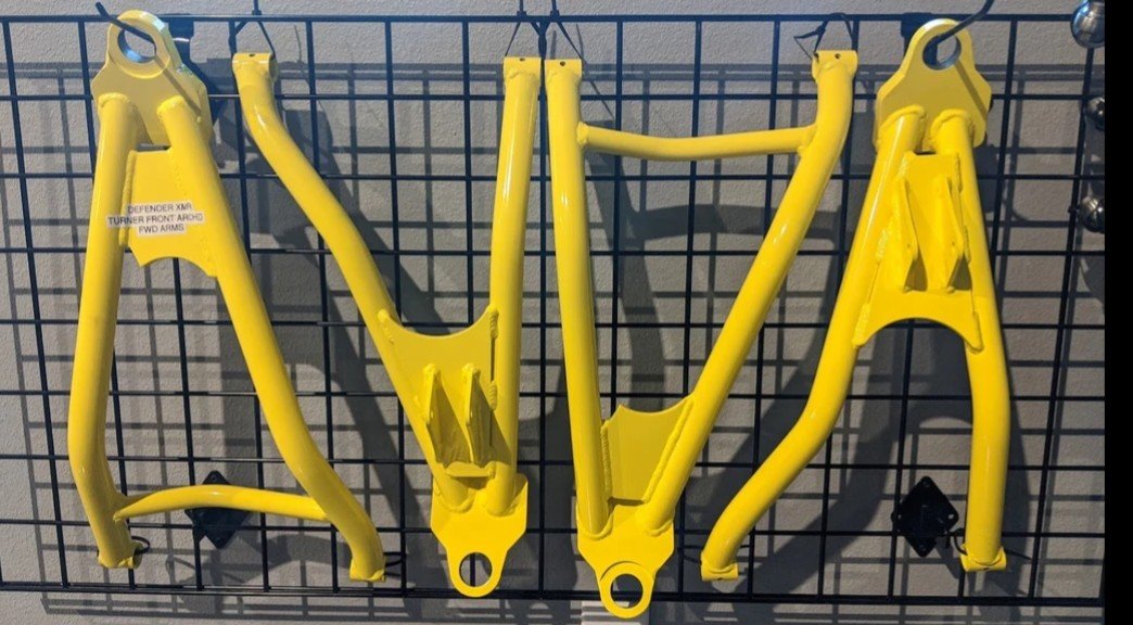 canam-defender-forward-arched-arms.jpg