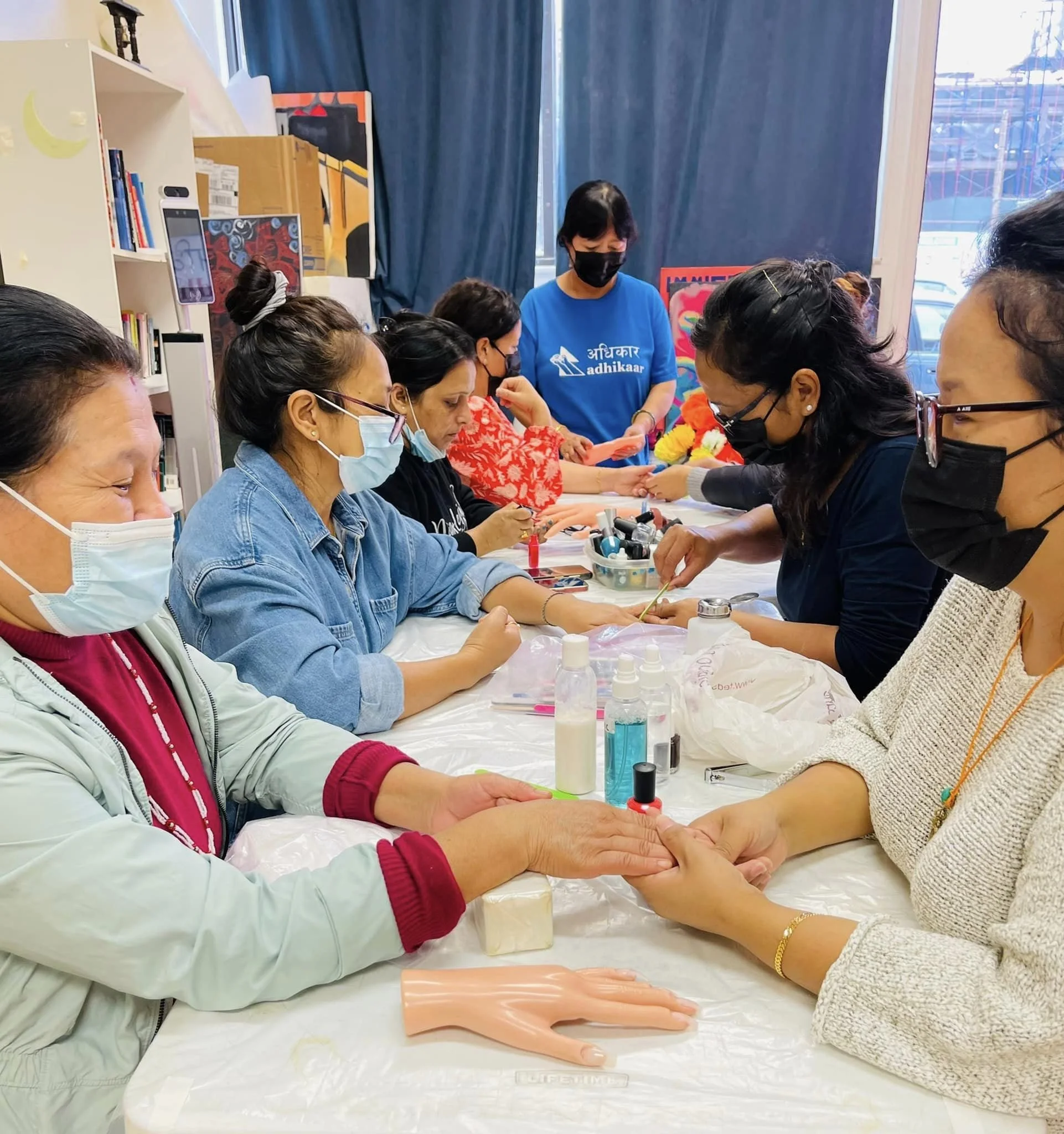 Our Nail Salon members learning how to do nails in their workforce development training in NYC. 