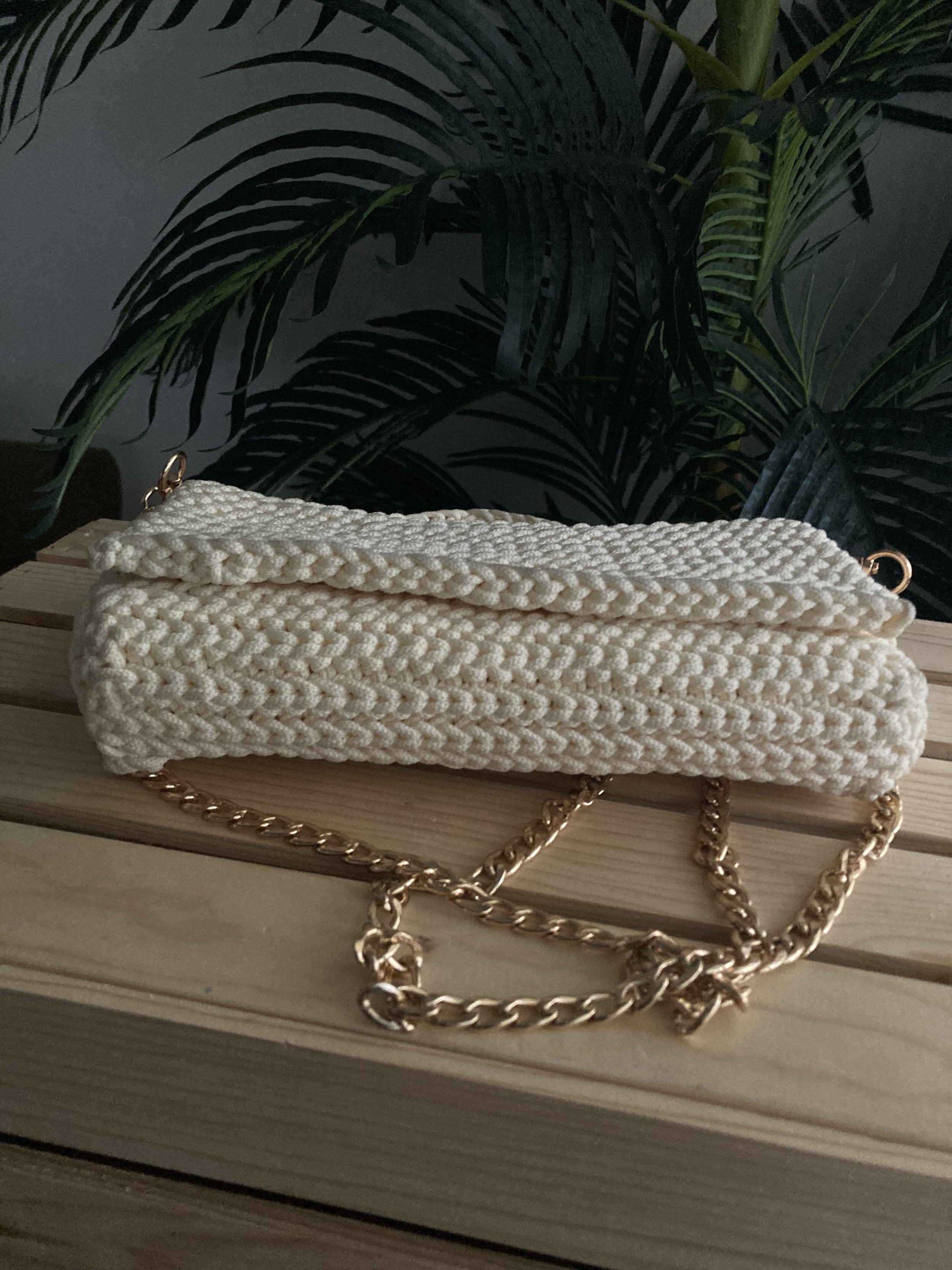 cream crochet clutch handbag with a crochet purse strap