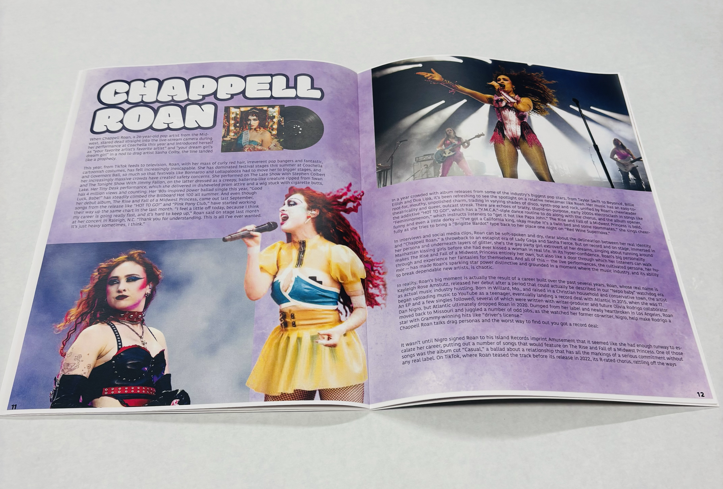 Open magazine with article about Chappell Roan, featuring photos of the singer performing on stage and a professional photo of her in colorful attire with red hair.