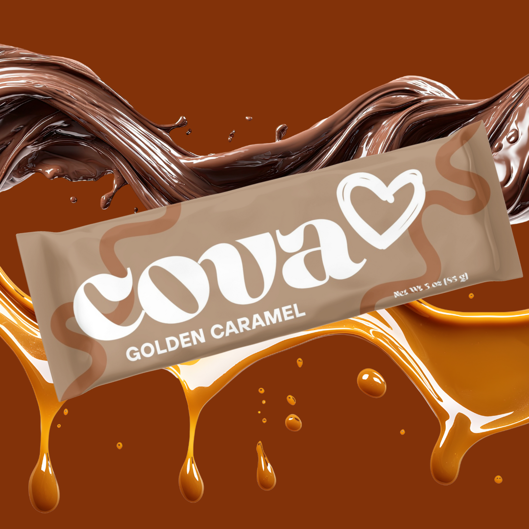 A Cadbury Coava Golden Caramel chocolate bar with caramel sauce splashing in the background.