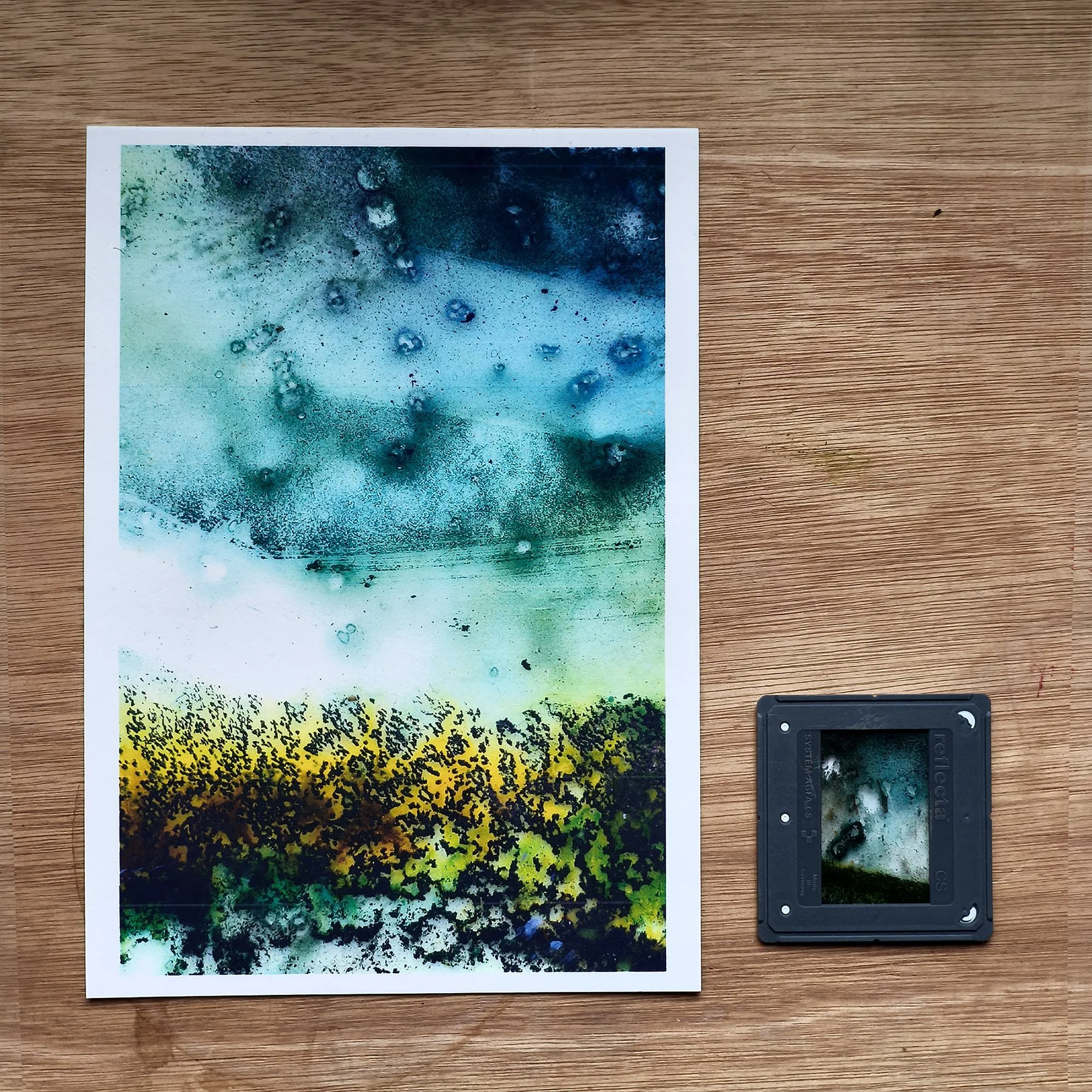 A 5×7 inch print shown beside the original 35mm slide it was scanned from.