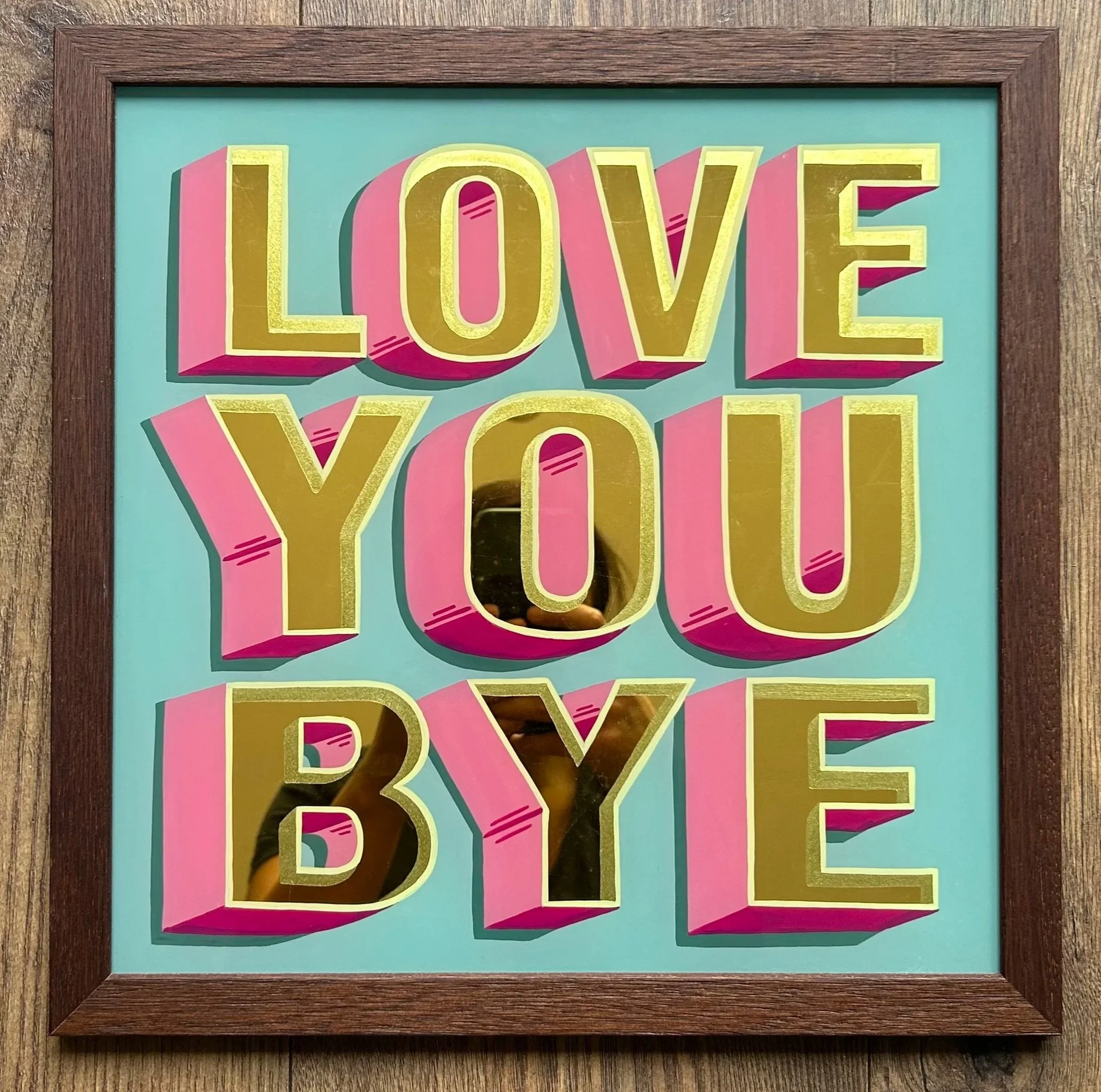 'LOVE YOU BYE' hand painted in reverse on glass, giled with 23.5ct gold leaf, in a walnut frame, bespoke original artwork, glass gilding, signwriting