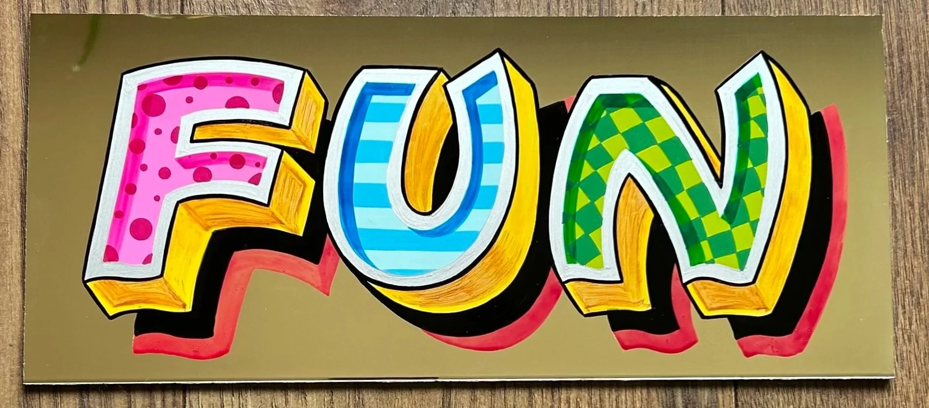 Fairground font in a Fred Fowle style, colourful fairground lettering, flamboyants on aluminium panel, funfair lettering