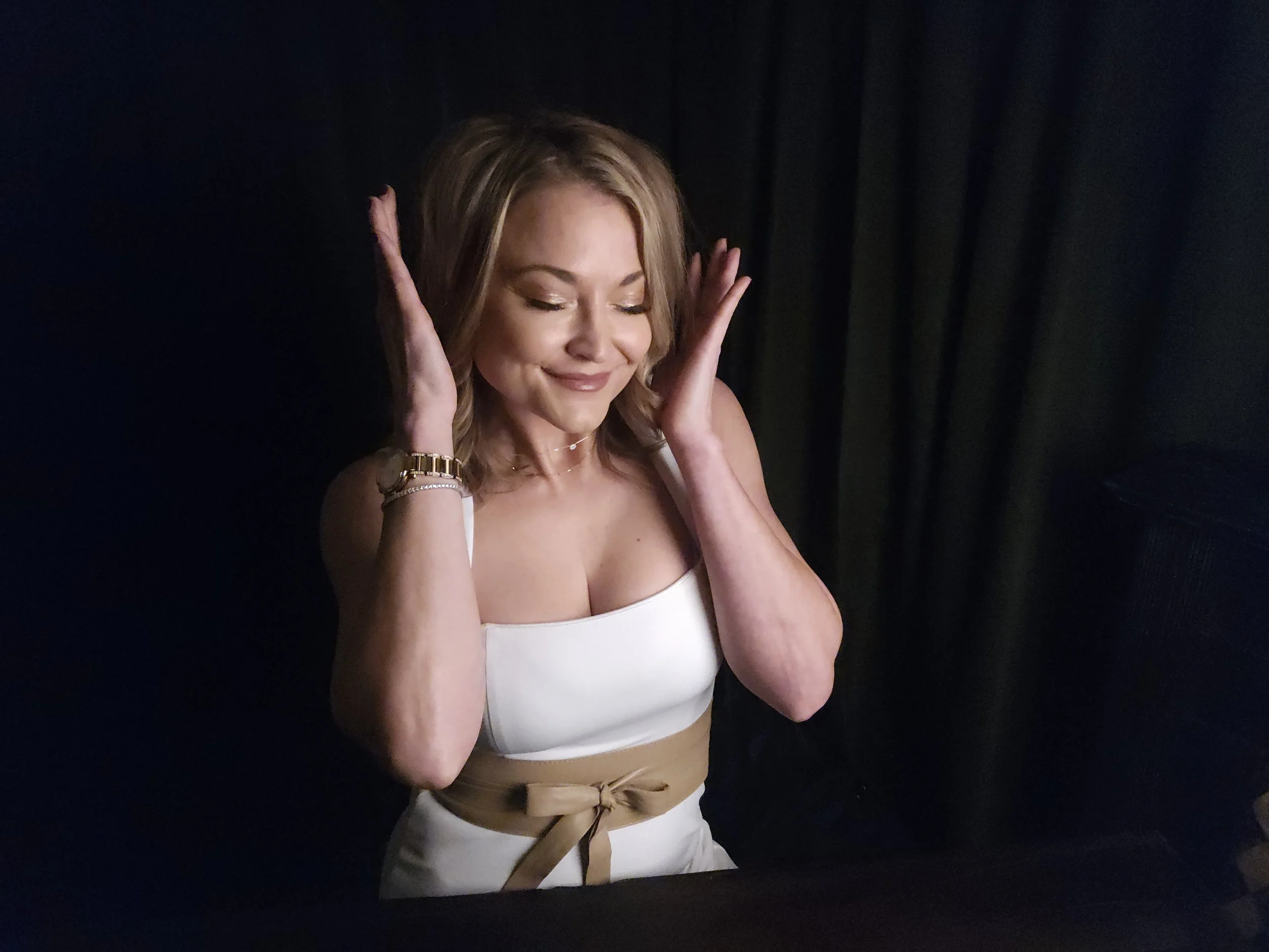 Jaz Nass listening to a guided hypnosis audio over a headset, demonstrating personalized mental reset and self support with Elevate Mindworks