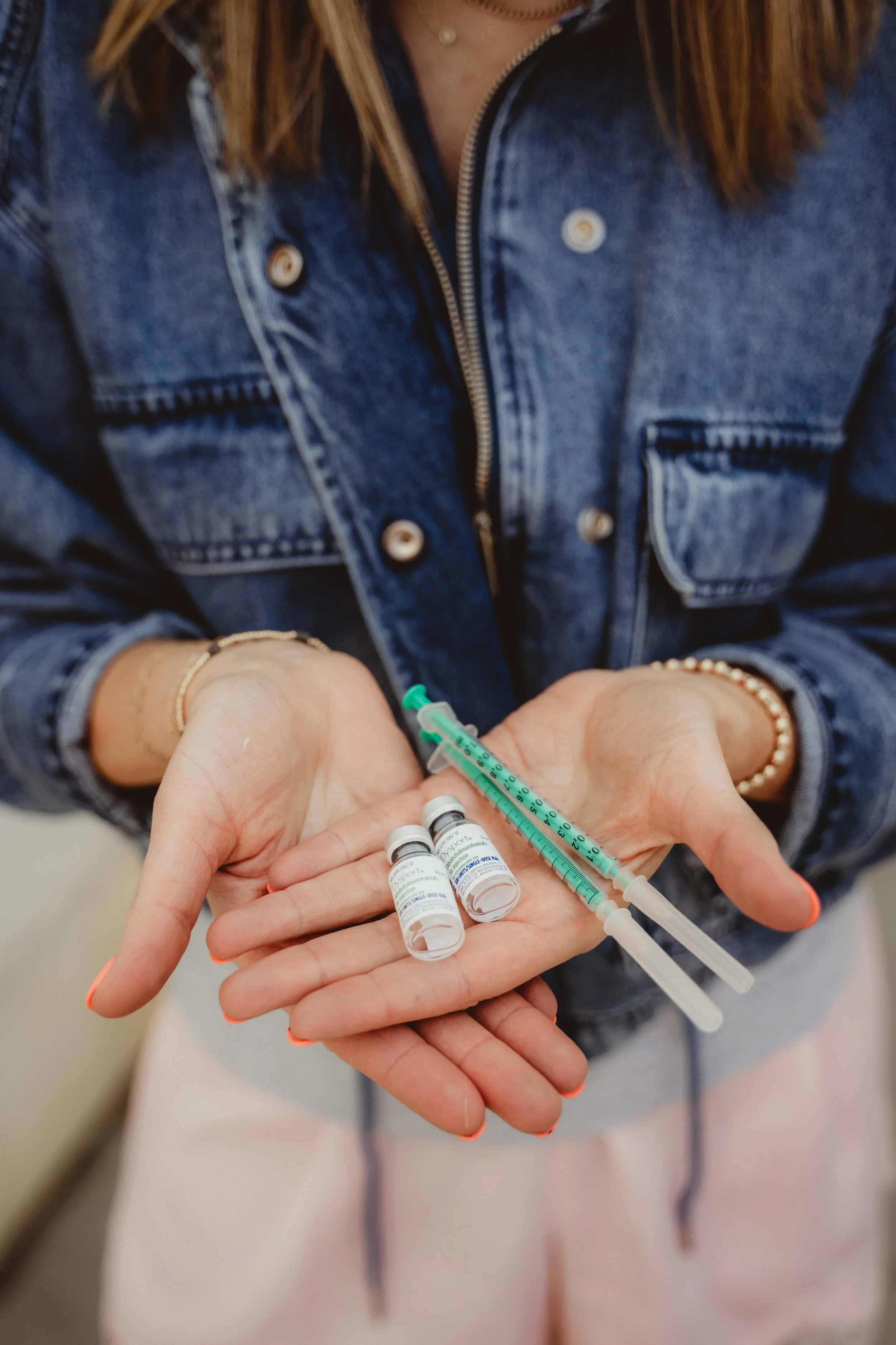 Aesthetic nurse holding skincare tools