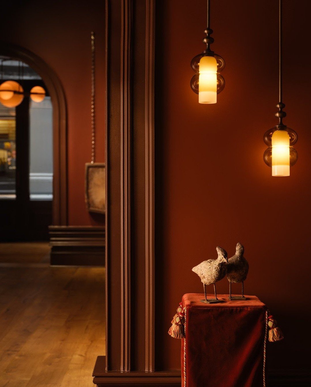 Lighting that glows from every angle.

At HOST on Howard in NYC, SkLO @sklostudio Perla Sconces, Prince Pendants, Union fixtures, and the Crown Chandelier bring sculptural light to life, all shown in Light Beige and Olivin glass with Antique Brass ha