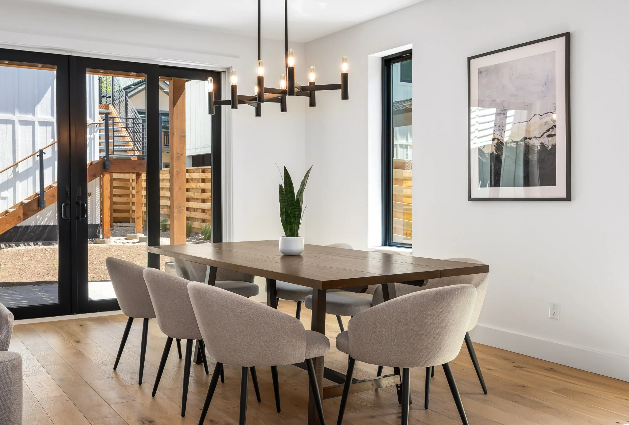 A modern dining room at Eighth Street Homes - a collection of Three Modern Luxury New Construction Single Family Homes in Downtown Steamboat