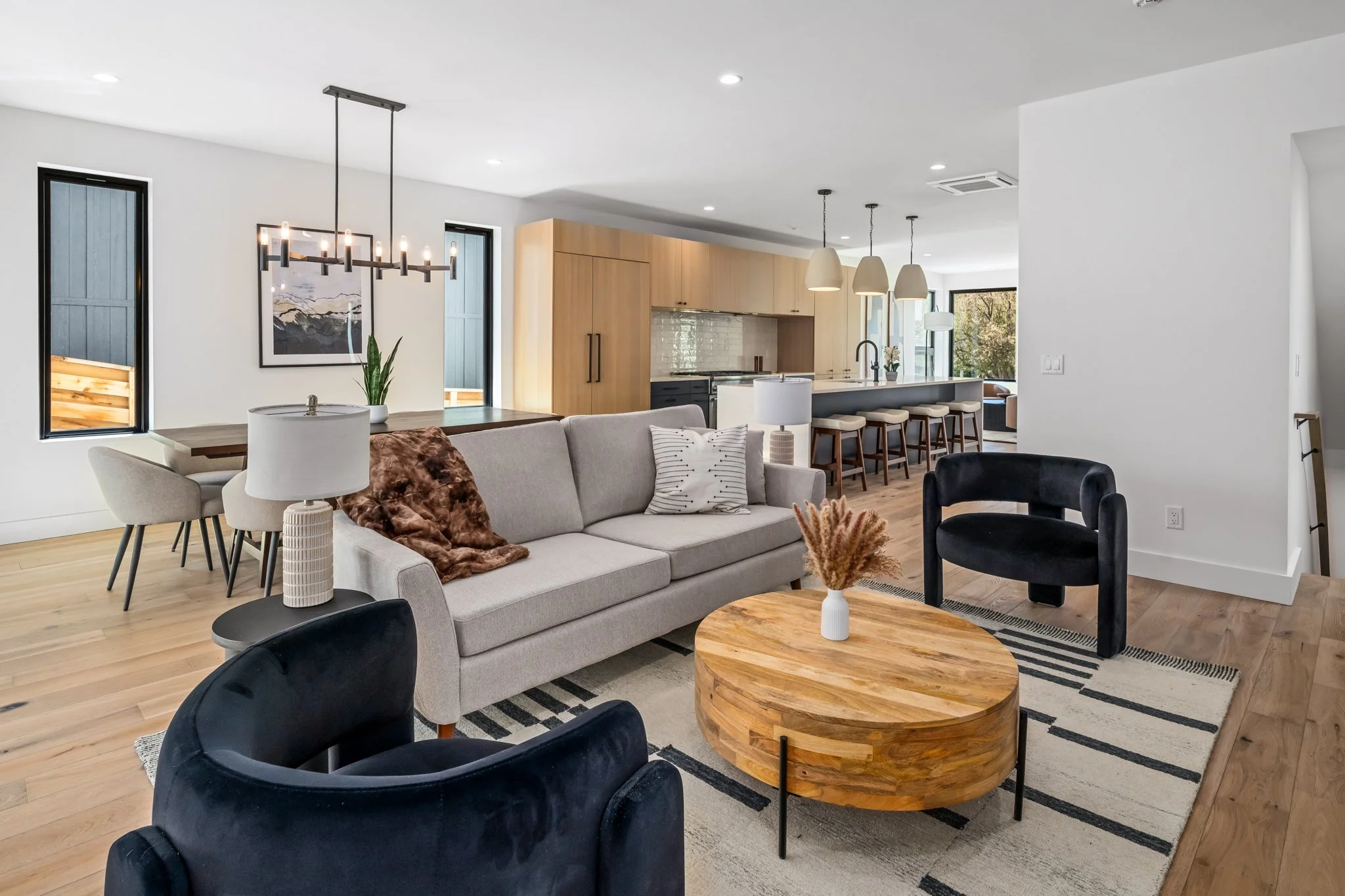 Open-concept living room and kitchen at Eighth Street Homes  - a collection of Three Modern Luxury New Construction Single Family Homes  in Downtown Steamboat