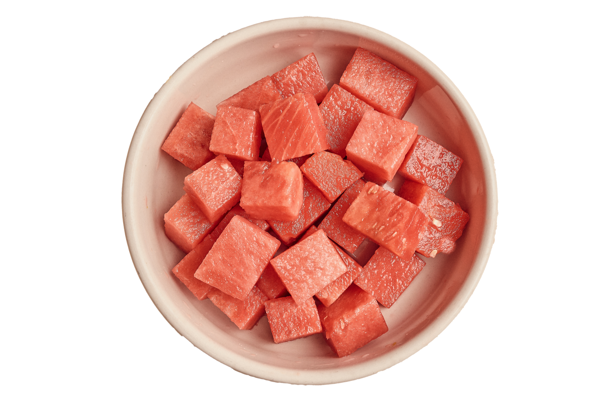 Cubed watermelon in a white bowl.