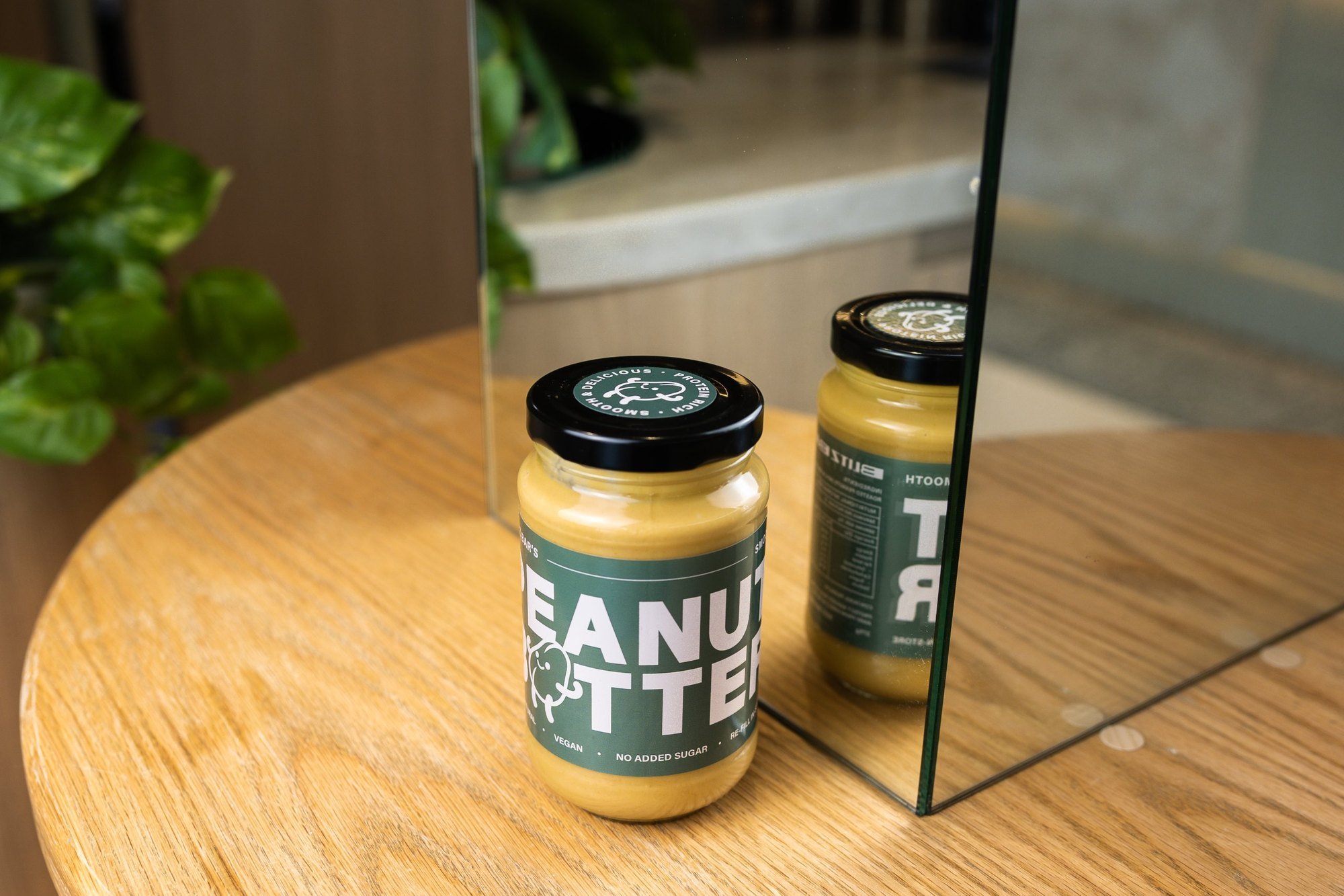 Jar of Blitz Bar smooth peanut butter on a table inside a Blitz Bar store in Melbourne