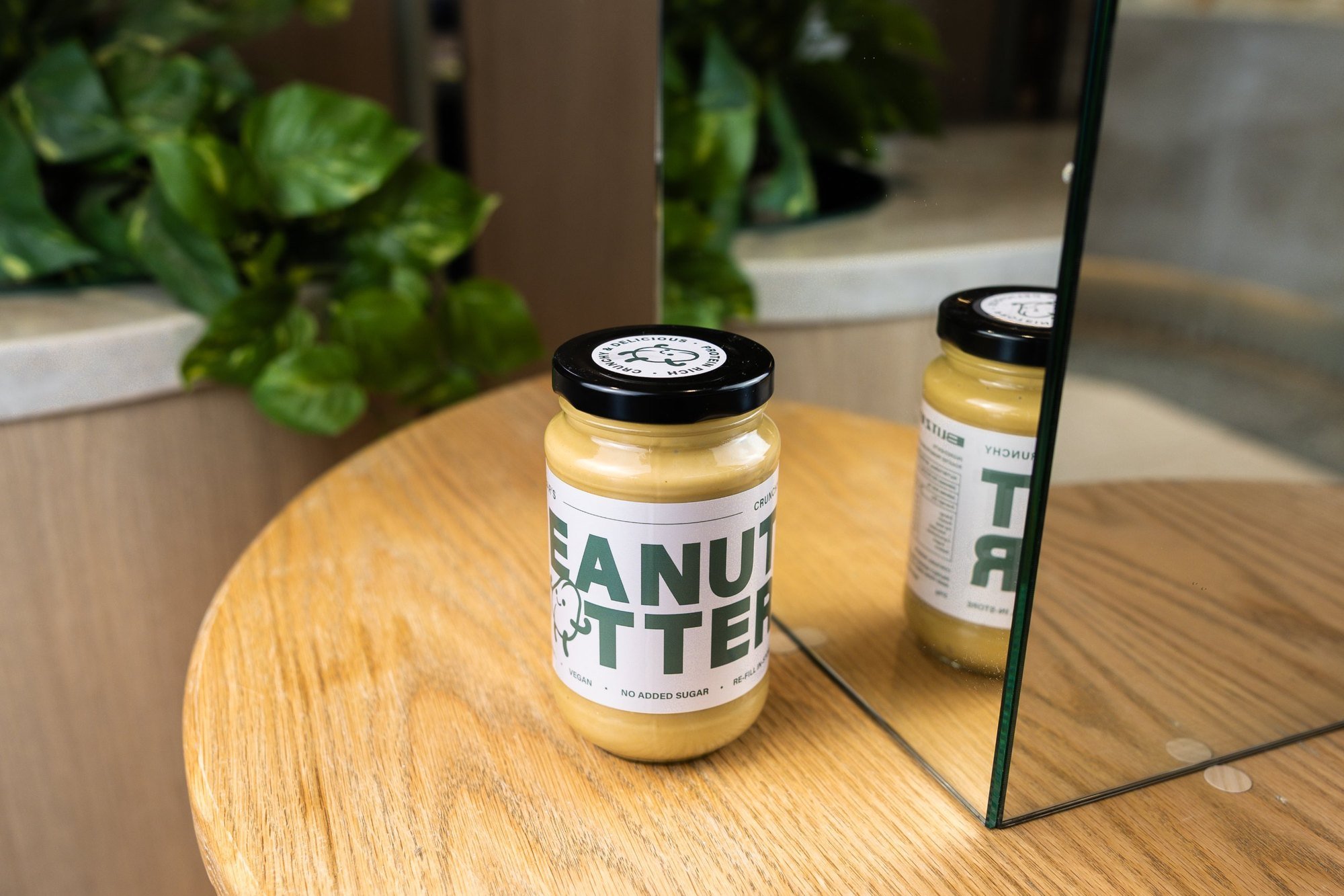 Jar of Blitz Bar crunchy peanut butter on a table inside a Blitz Bar store in Melbourne