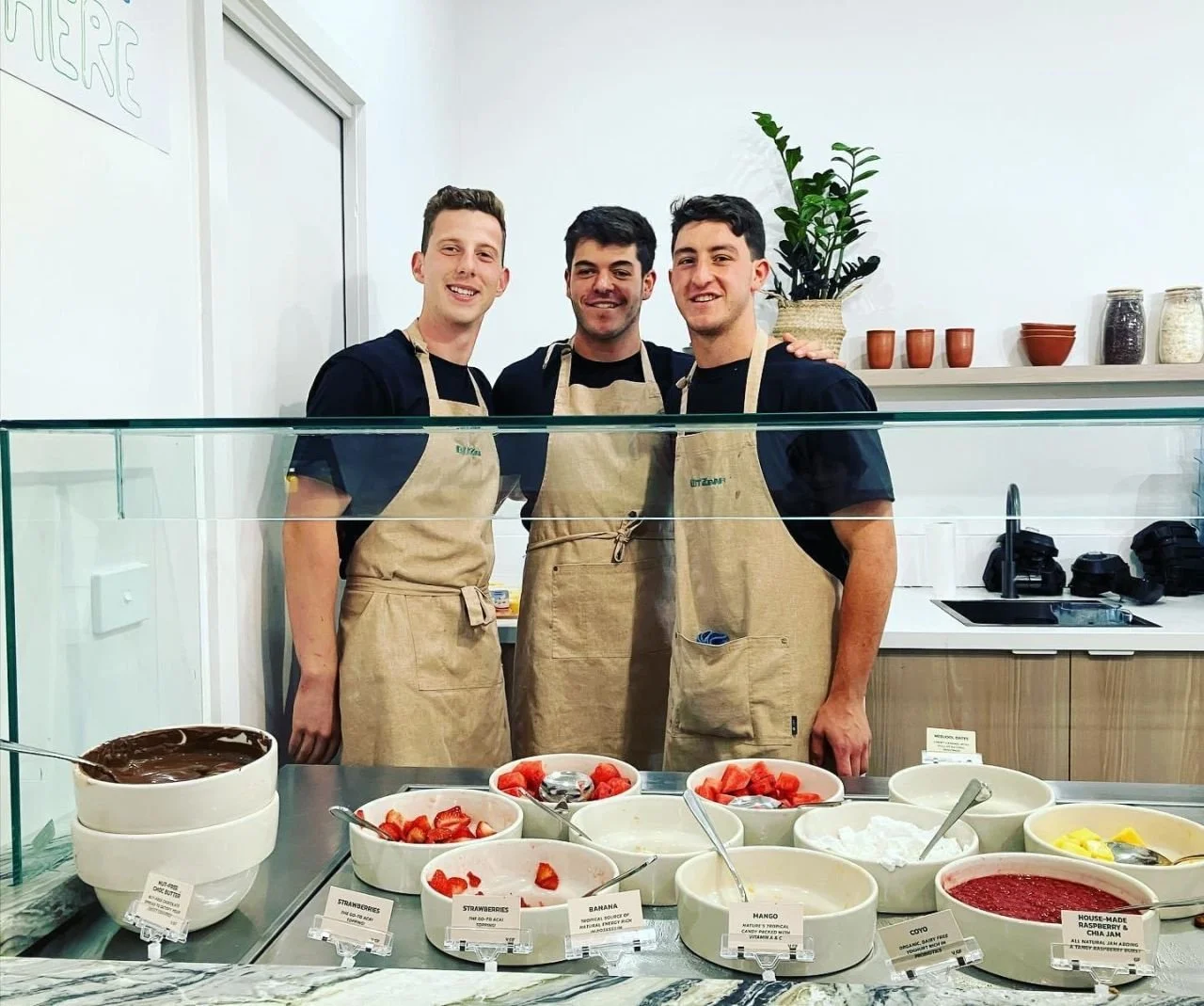 The three Blitz Bar founders behind the toppings bar at the Malvern acai bar in Melbourne