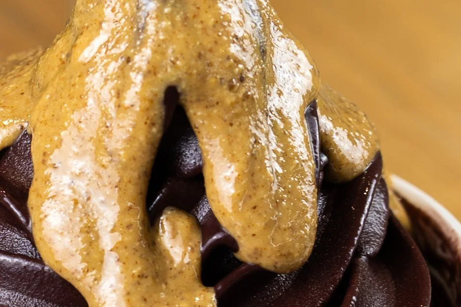 Blitz Bar almond butter poured over a chocolate acai bowl