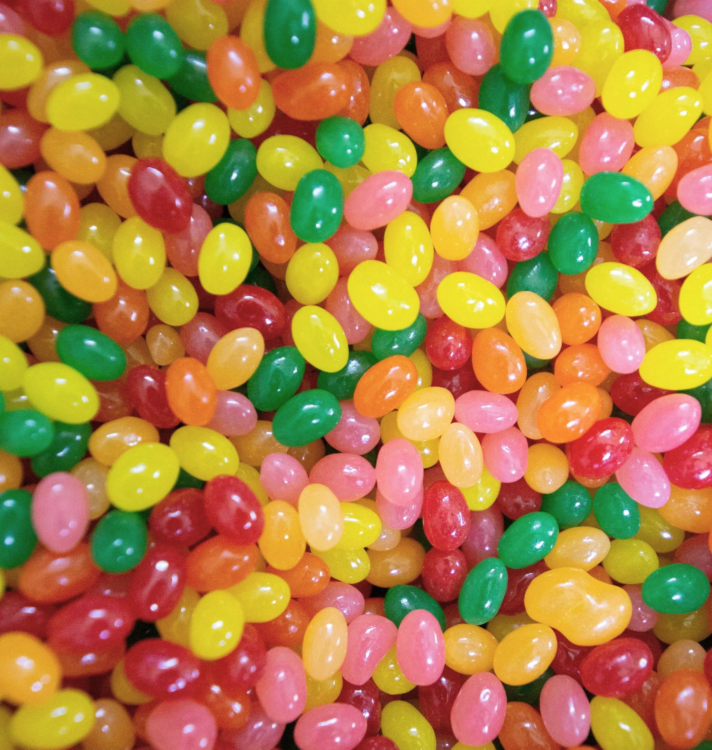 Colorful jelly beans in red, yellow, green, pink, and orange.